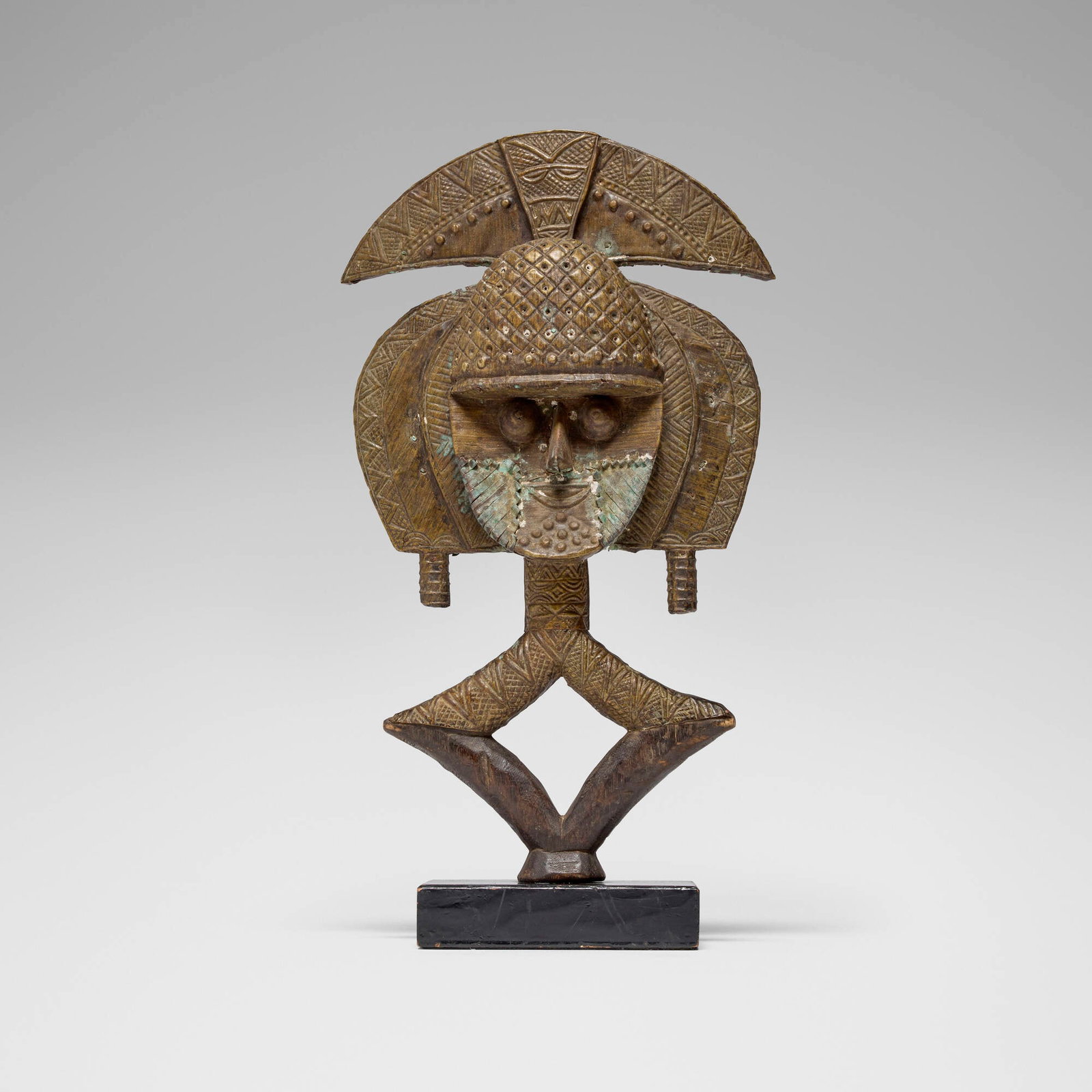 Kota, Mbulu Ngulu reliquary guardian figure: Kota Mbulu Ngulu reliquary guardian figure Gabon, 20th century carved wood, brass 18.5 h x 10 w x 2.5 d in (47 x 25 x 6 cm) This work will ship from Los Angeles, California.