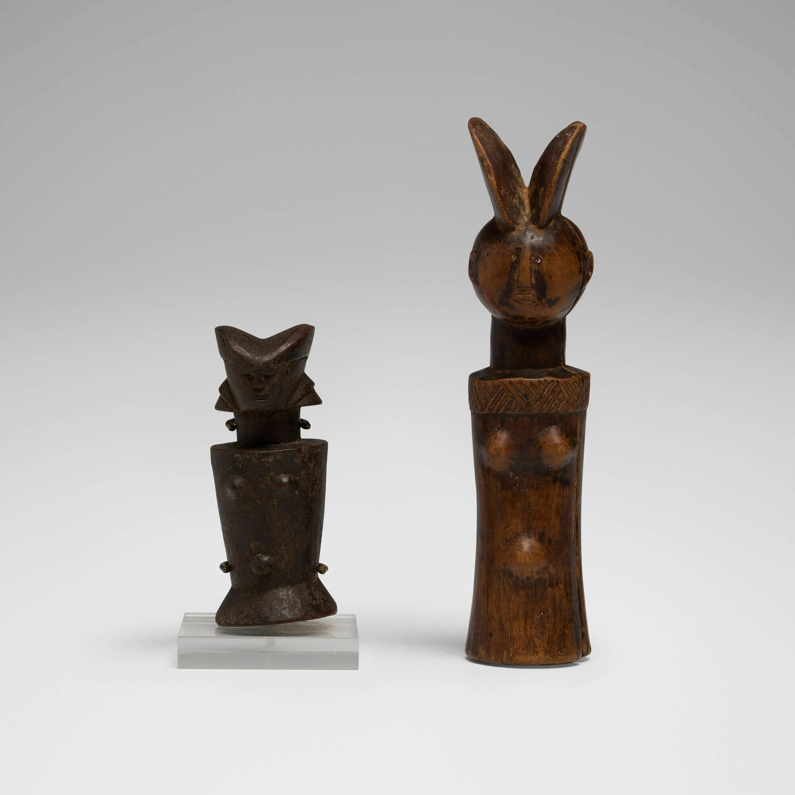Kwere, Dolls, set of two: Kwere Dolls, set of two Tanzania, 20th century carved wood 9.5 h x 2.5 w x 2 d in (24 x 6 x 5 cm) 6 h x 3 w x 3 d in (15 x 8 x 8 cm) Provenance: Private Collection, Maryland This work will ship from