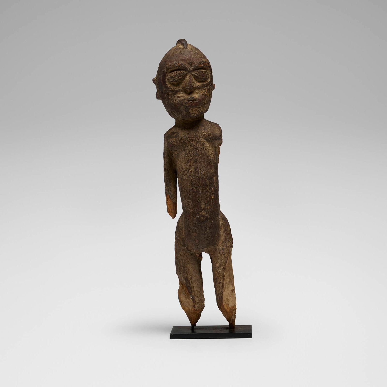 Lobi, Bateba (figure): Lobi Bateba (figure) Ghana, 20th century carved wood with encrustation 14.5 h x 4 w x 2.5 d in (37 x 10 x 6 cm) Provenance: Private Collection, Maryland This work will ship from Chicago, Illinois.