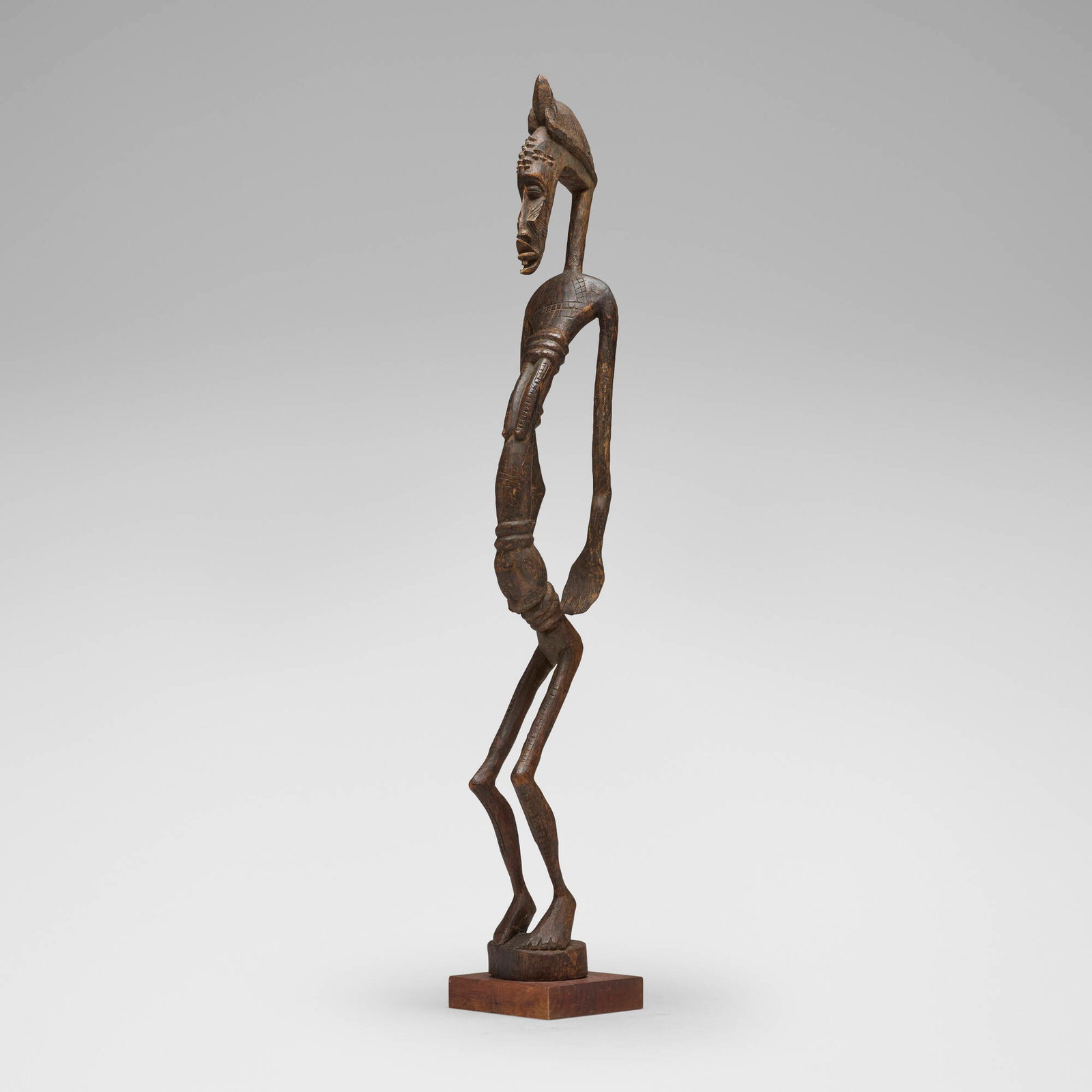 Senufo, Female figure: Senufo Female figure Cote d'Ivoire, 20th century carved wood 47 h x 6.5 w x 7 d in (119 x 17 x 18 cm) Provenance: Private Collection, Maryland This work will ship from Chicago, Illinois.