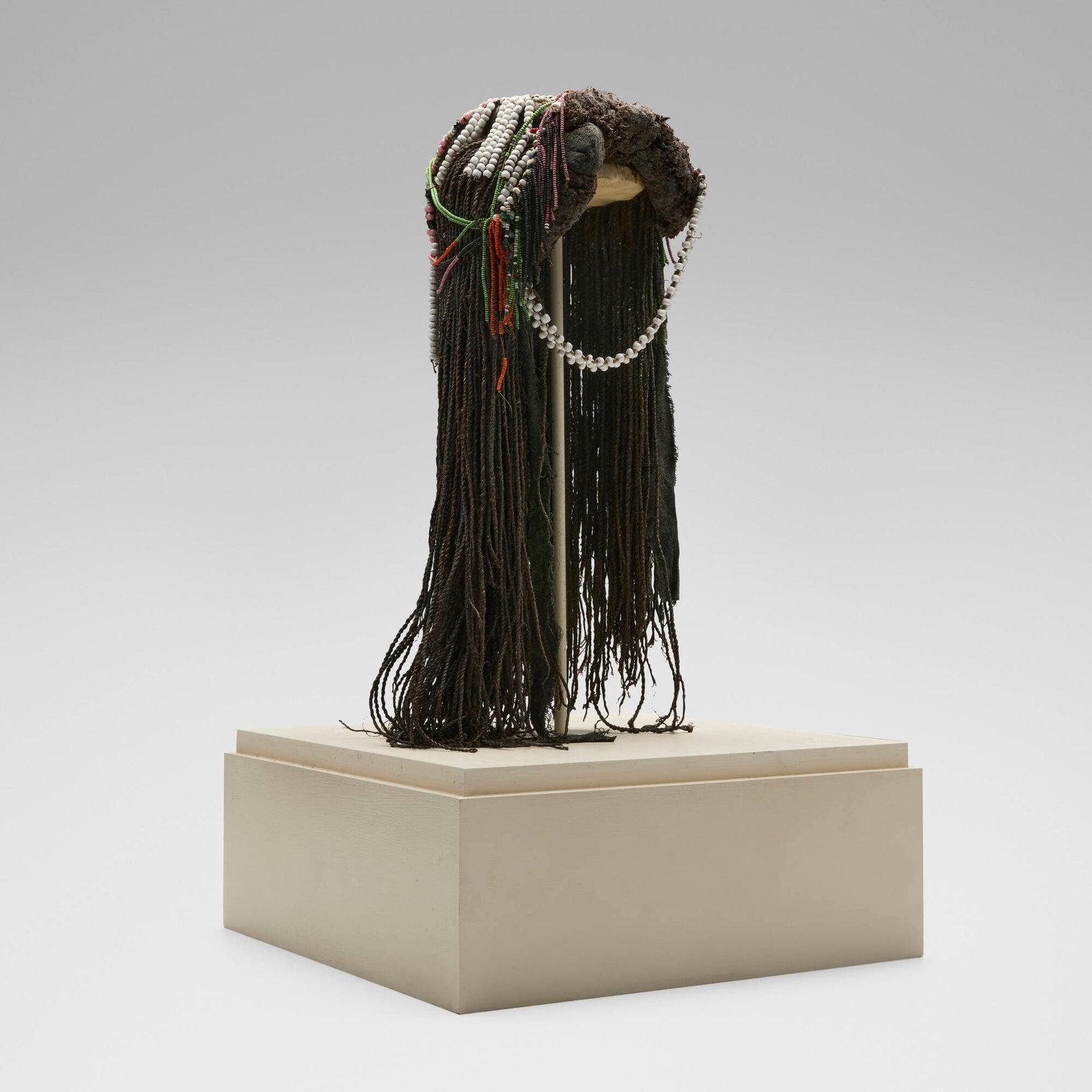 Mbukushu, Headdress: Mbukushu Headdress Okavango River Basin, 20th century woven fibers, beads 19 h x 8 w x 8 d in (48 x 20 x 20 cm) Provenance: Private Collection, Maryland This work will ship from Chicago, Illinois.