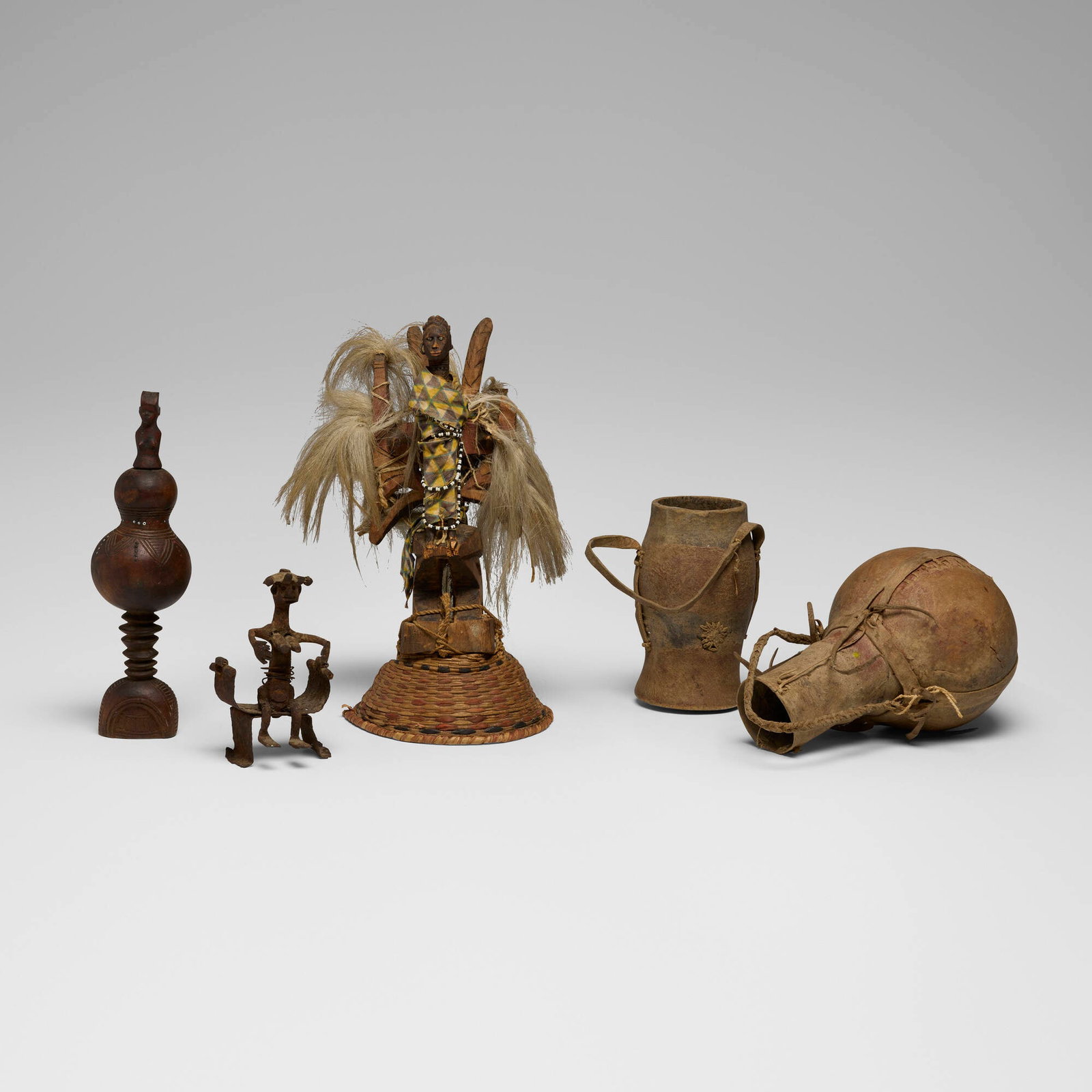 African, Collection of objects: African Collection of objects 20th century carved wood, raffia, cloth, beads, iron, cord, paint, hair largest: 14.5 h x 6 w x 8 d in (37 x 15 x 20 cm) smallest: 6.25 h x 3.5 w x 3 d in (16 x 9 x 8