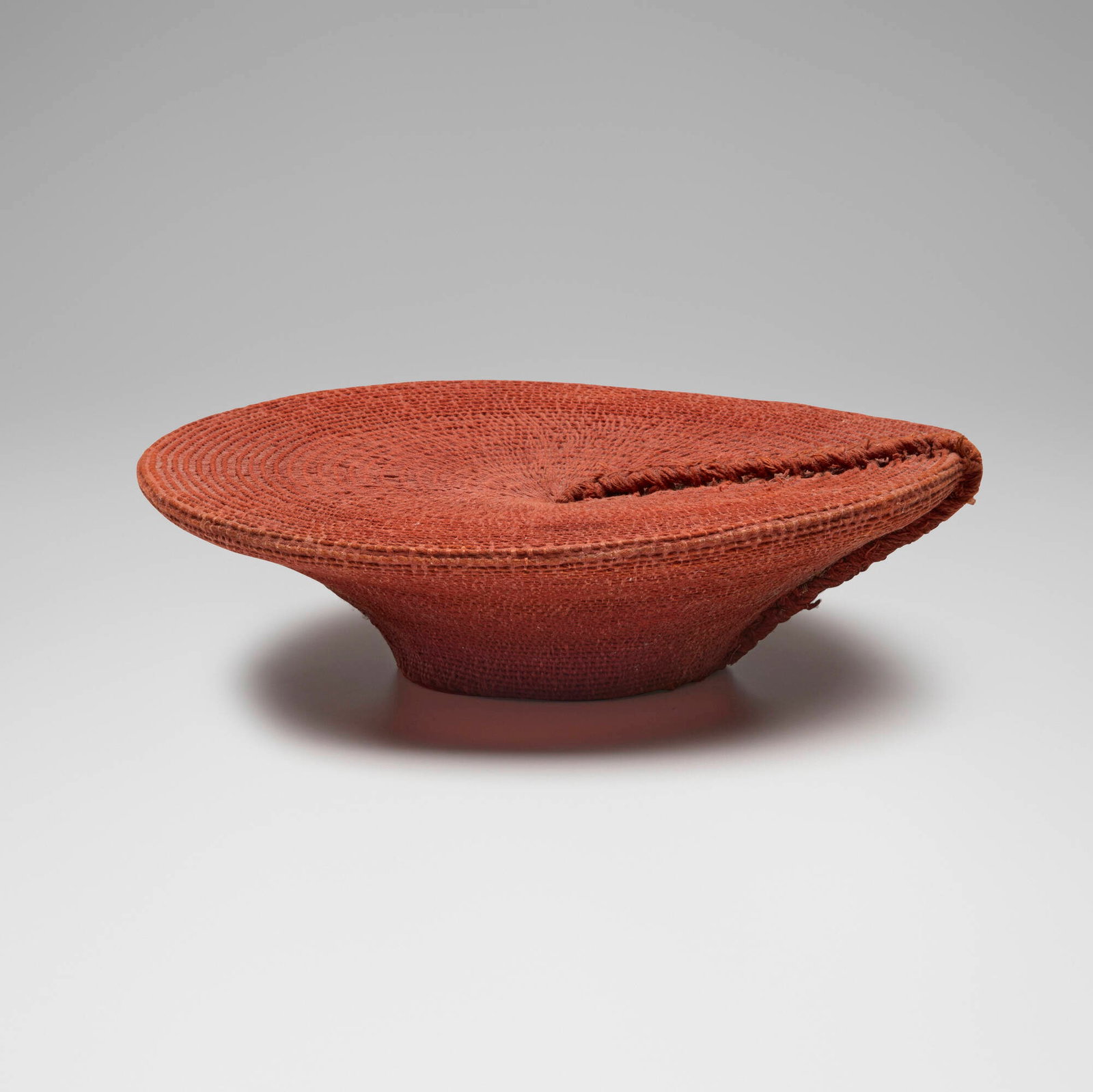 Zulu, Woman's hat: Zulu Woman's hat South Africa, 20th century woven fabric, steel tacs 5 h x 17 dia in (13 x 43 cm) Provenance: Private Collection, Maryland This work will ship from Chicago, Illinois.