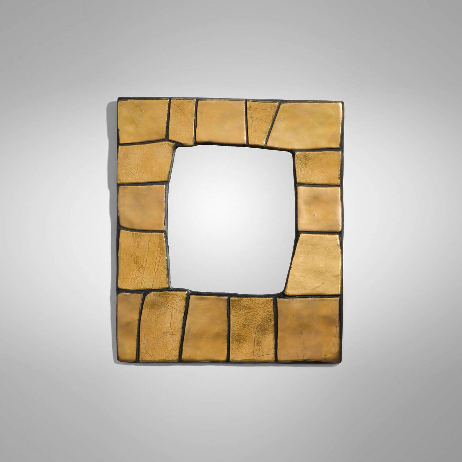 Mithe Espelt, Cuzco wall mirror: Mithe Espelt Cuzco wall mirror France, c. 1974 glazed and gilt earthenware, mirrored glass 12.5 h x 10.75 w x 0.5 d in (32 x 27 x 1 cm) Provenance: Private Collection Literature: Mithe Espelt: the