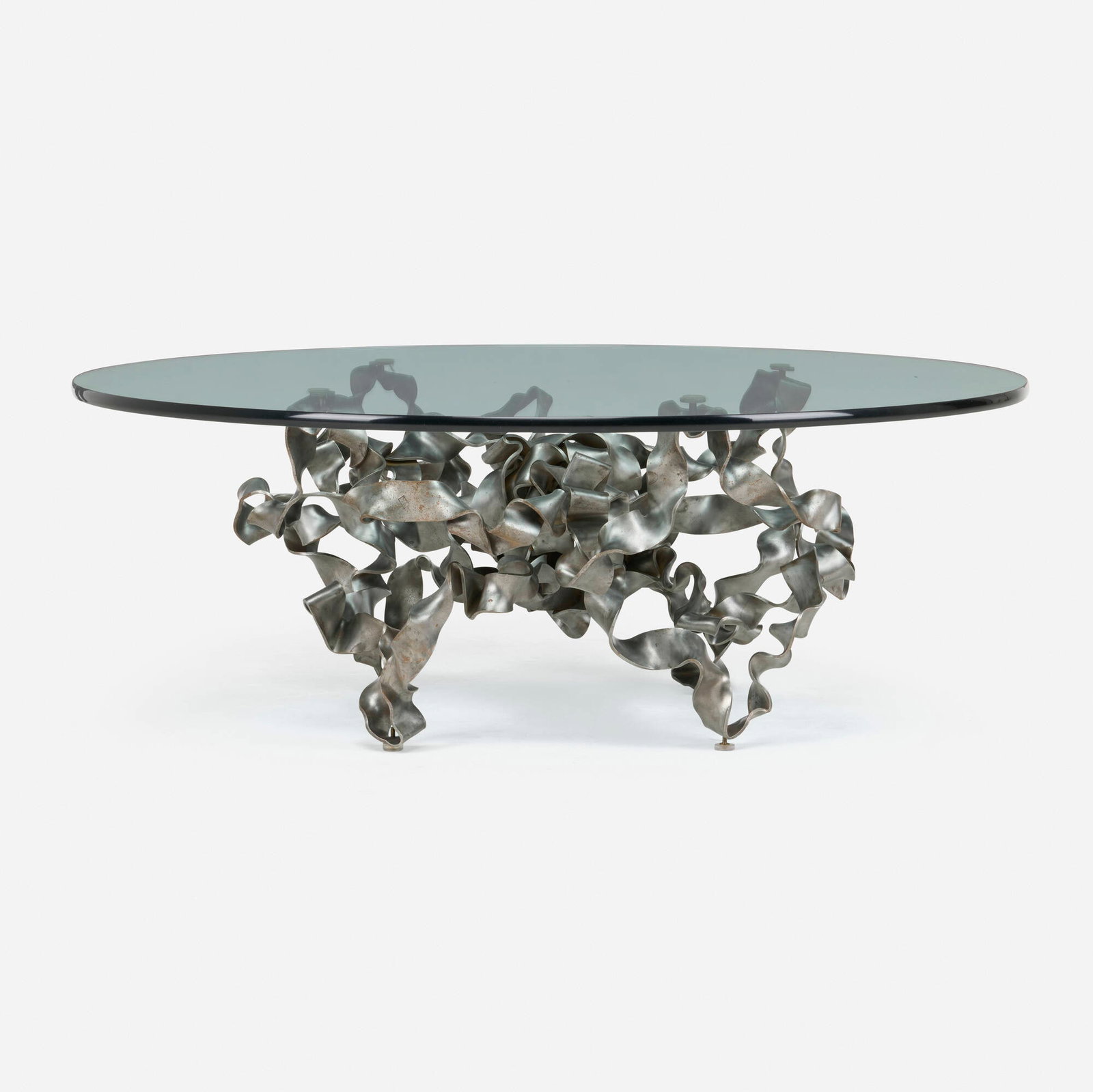 Fran Taubman, Ribbon coffee table: Fran Taubman Ribbon coffee table USA, c. 2008 patinated steel, glass 18 h x 47.5 dia in (46 x 121 cm) This work will ship from Lambertville, New Jersey.