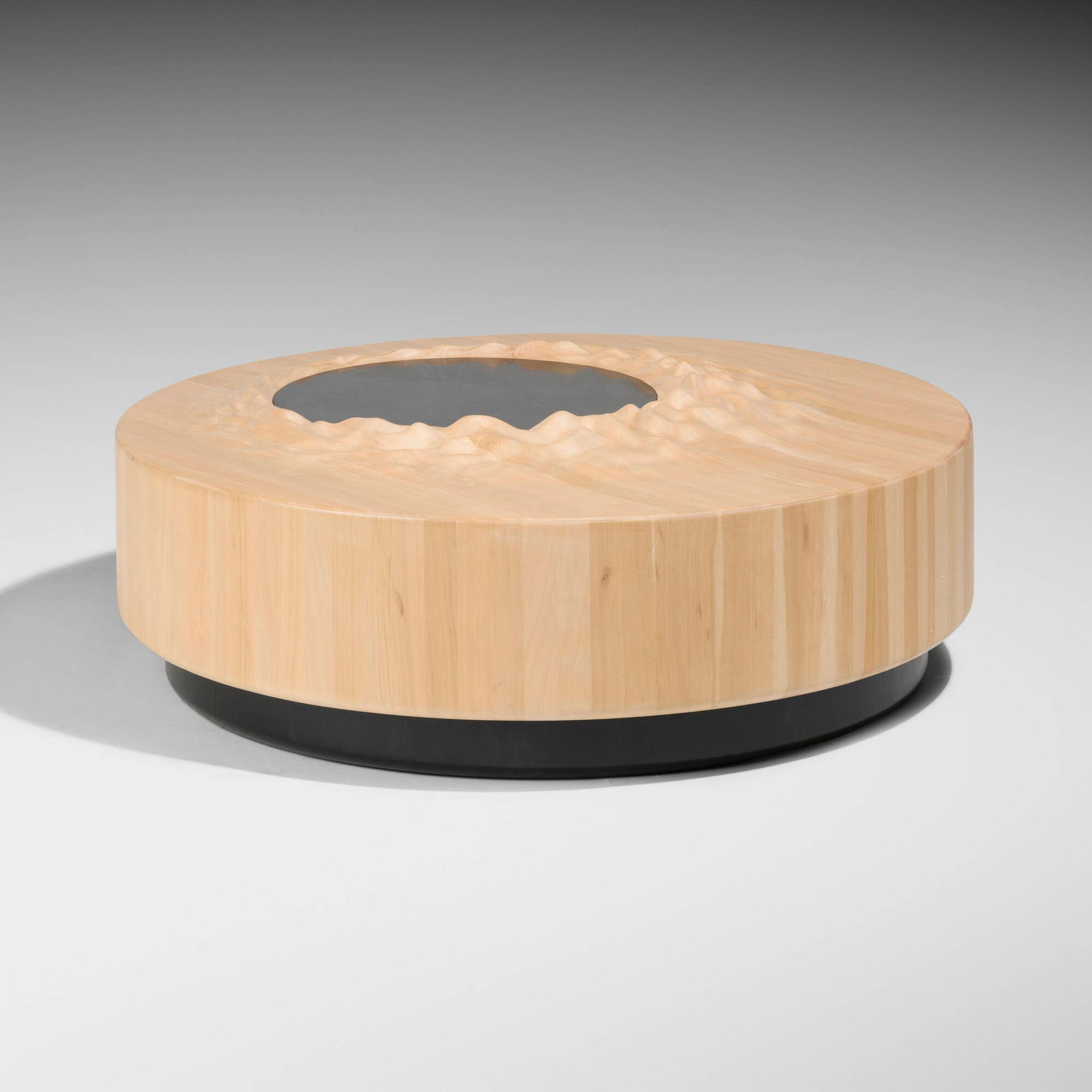 gt2P (great things to People), Imaginary Geographies coffee table: gt2P (great things to People) Imaginary Geographies coffee table Chile, 2018 lenga, lacquered wood, black basalt 17 h x 51 dia in (43 x 130 cm) Provenance: Private Collection Exhibited: GT2P: