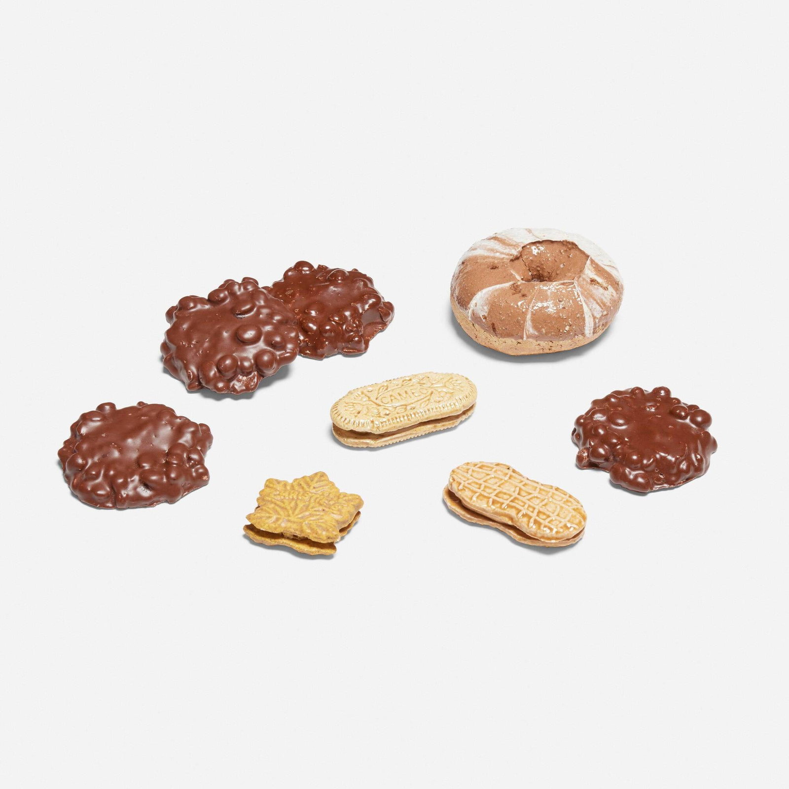 David Gilhooly, Cookies and Donut, set of eight: David Gilhooly Cookies and Donut, set of eight 1973-75 glazed earthenware largest: 1.25 h x 3 dia in (3 x 8 cm) smallest: 0.5 h x 1.625 w x 1.75 d in (1 x 4 x 4 cm) Set is comprised of seven cookies