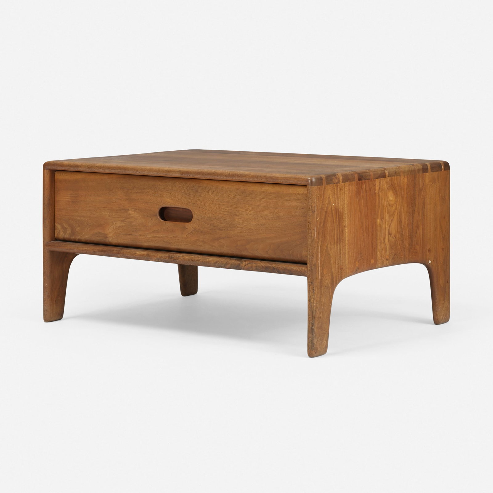 Sam Maloof, Coffee table: Sam Maloof Coffee table USA, c. 1975 walnut 16 h x 32 w x 24 d in (41 x 81 x 61 cm) Table features one drawer, dovetail joinery, and circular tenon details. Branded studio mark to interior