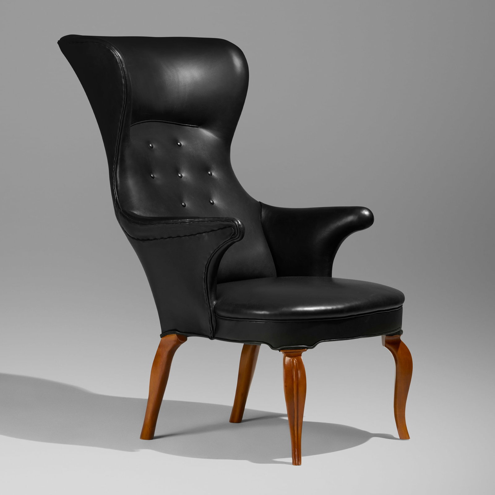 Frits Henningsen, Wingback chair: Frits Henningsen Wingback chair Denmark, 1935 leather upholstery, maple 45 h x 27.25 w x 36.75 d in (114 x 69 x 93 cm) Provenance: Private Collection, Copenhagen | Private Collection Literature:
