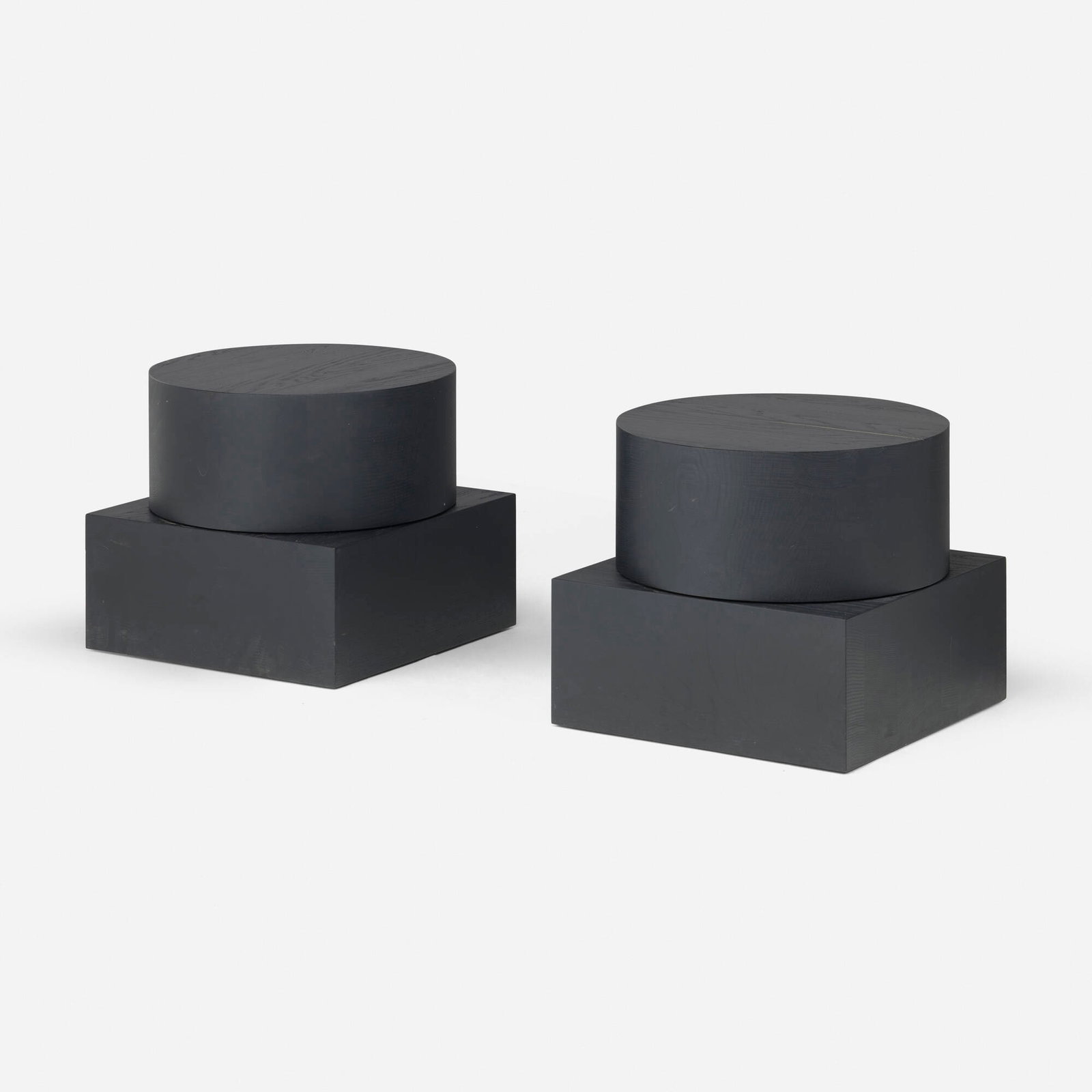 Christian Woo, Noga occasional tables, pair: Christian Woo Noga occasional tables, pair Spain/Canada, 2020 stained ash 16.75 h x 17.875 w x 17.875 d in (43 x 45 x 45 cm) Impressed manufacturer's mark to underside of each example