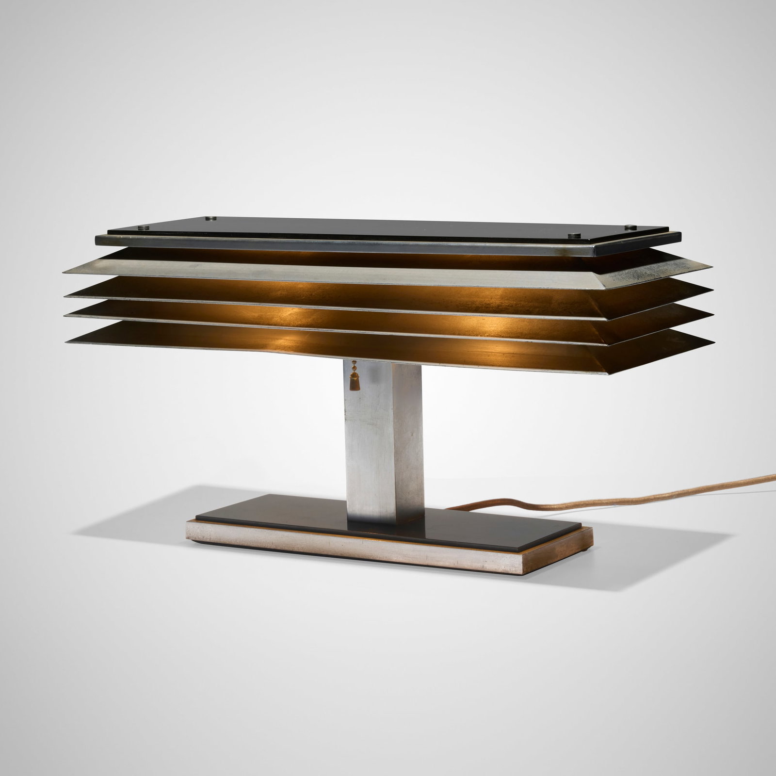 Walter von Nessen, Rare table lamp: Walter von Nessen Rare table lamp Nessen Studio, Inc. USA, c. 1935 Bakelite, aluminum 8.375 h x 16 w x 6.25 d in (21 x 41 x 16 cm) Impressed manufacturer's mark and number to underside of shade