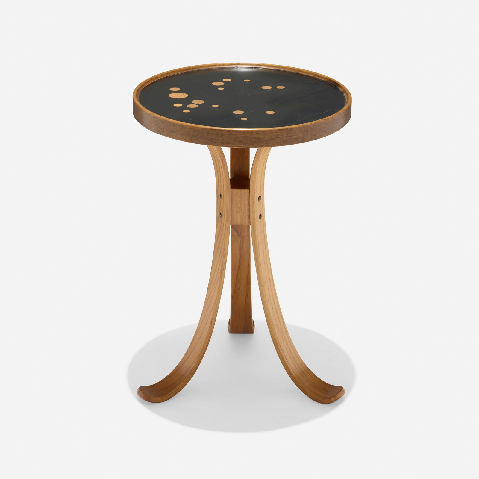 Edward Wormley, Constellation occasional table: Edward Wormley Constellation occasional table Dunbar USA, 1962 laminate, walnut, ash 19.25 h x 13 dia in (49 x 33 cm) Metal manufacturer's label to underside 'Dunbar Berne Indiana'.