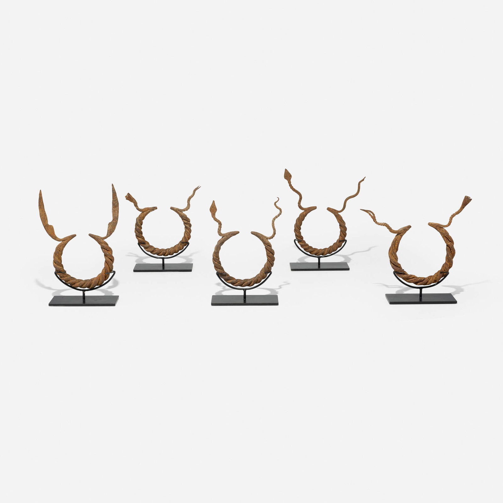 Mumuye, Currency torques, set of five: Mumuye Currency torques, set of five Nigeria, 20th century wrought iron largest: 11.25 h x 8.5 w x 1 d in (29 x 22 x 3 cm) smallest: 8 h x 8.5 w x 1 d in (20 x 22 x 3 cm) Provenance: Collection of