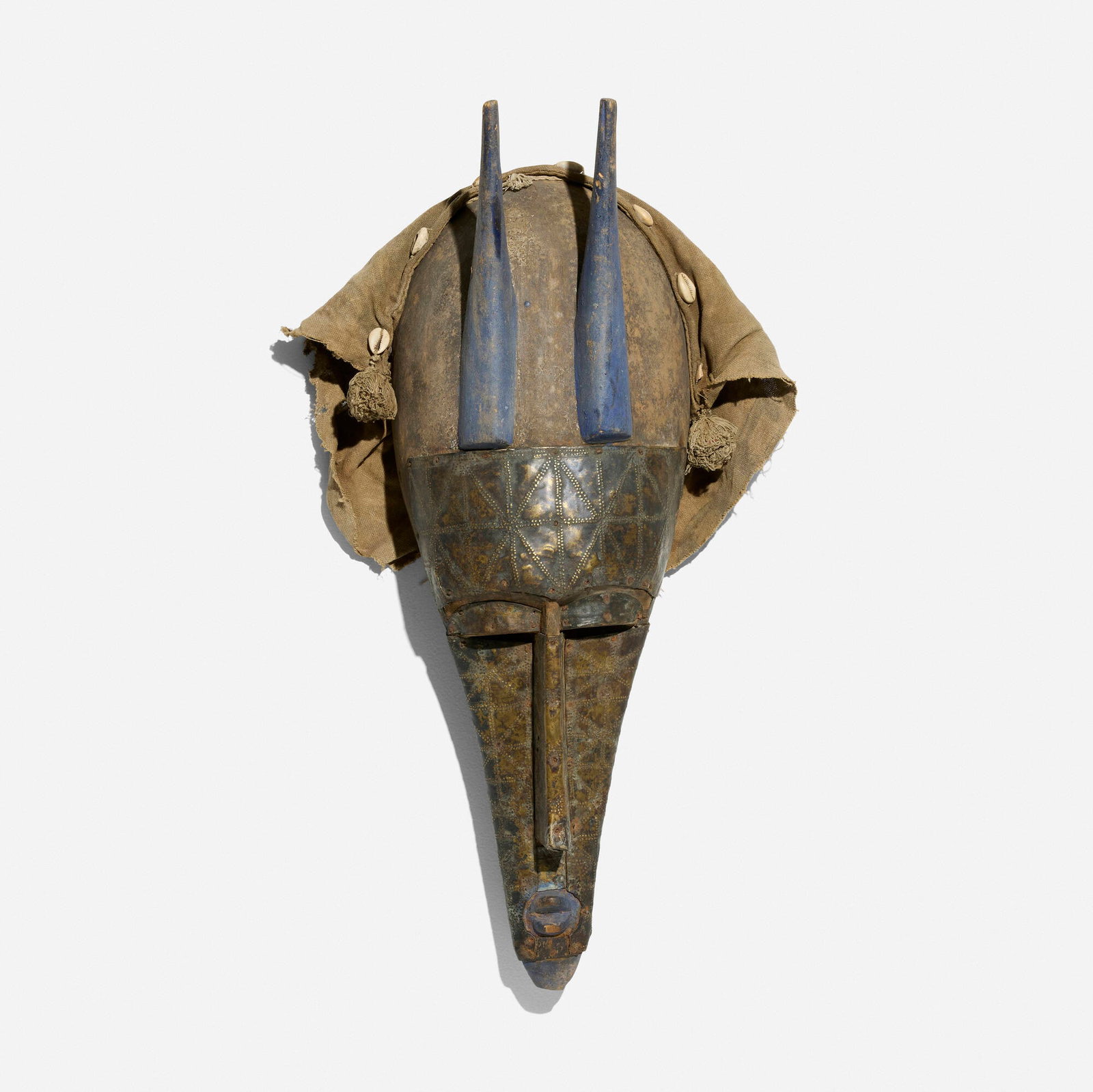 Marka, Mask: Marka Mask Mali, 20th century carved wood, brass, cloth, cowry shells 25 h x 7 w x 5 d in (63 x 18 x 13 cm) Provenance: Collection of Normand Mainville This work will ship from Chicago, Illinois.