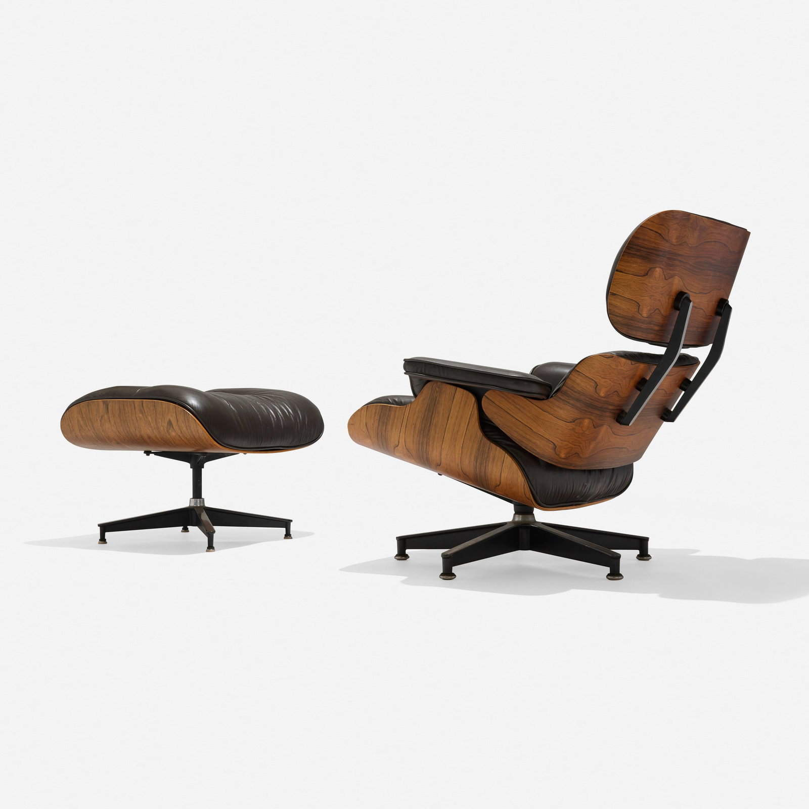 Charles and Ray Eames, 670 lounge chair and 671 ottoman: Charles and Ray Eames 670 lounge chair and 671 ottoman Herman Miller USA, 1956 / c. 1980 rosewood plywood, leather upholstery, enameled and brushed aluminum chair: 32 h x 33 w x 30 d in (81 x 84 x 76