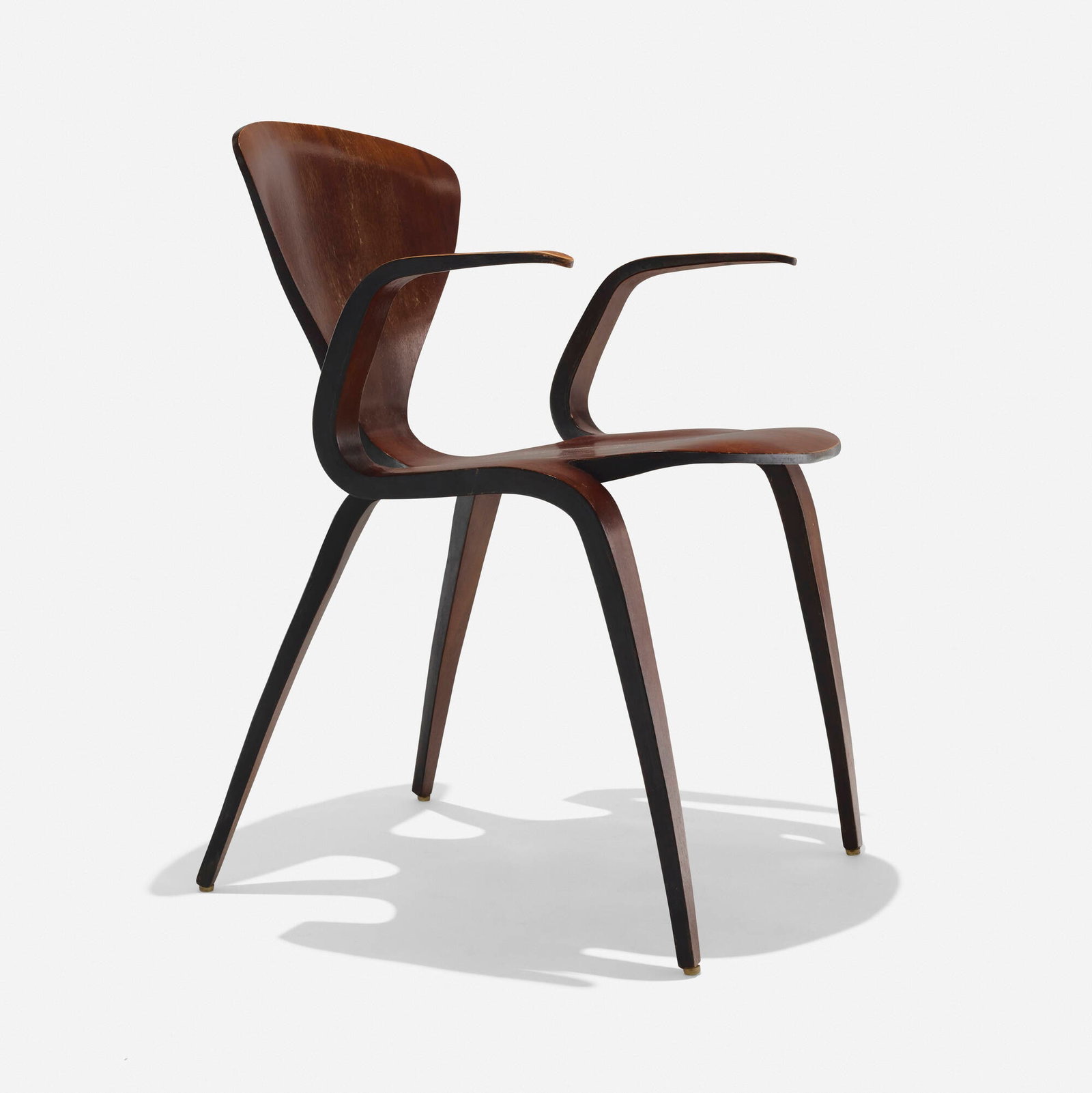 Norman Cherner, Armchair: Norman Cherner Armchair Plycraft USA, c. 1960 laminated walnut 31.25 h x 23.75 w x 22.5 d in (79 x 60 x 57 cm) Provenance: Collection of Normand Mainville This work will ship from Chicago, Illinois.