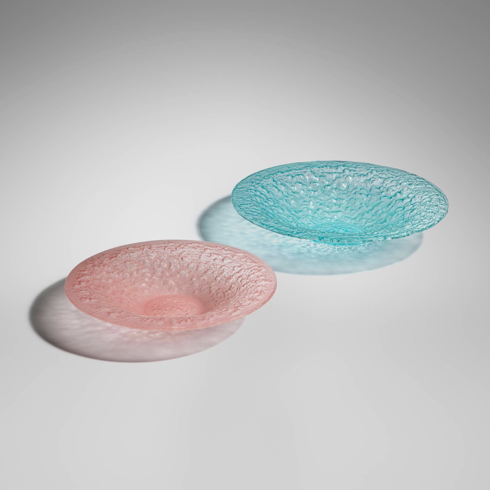 Glen Lukens, Bowls, set of two: Glen Lukens Bowls, set of two c. 1950 molded glass 3.75 h x 19 dia in (10 x 48 cm) 2.75 h x 16 dia in (7 x 41 cm) A similar example of this design is in the Metropolitan Museum of Art, New York.