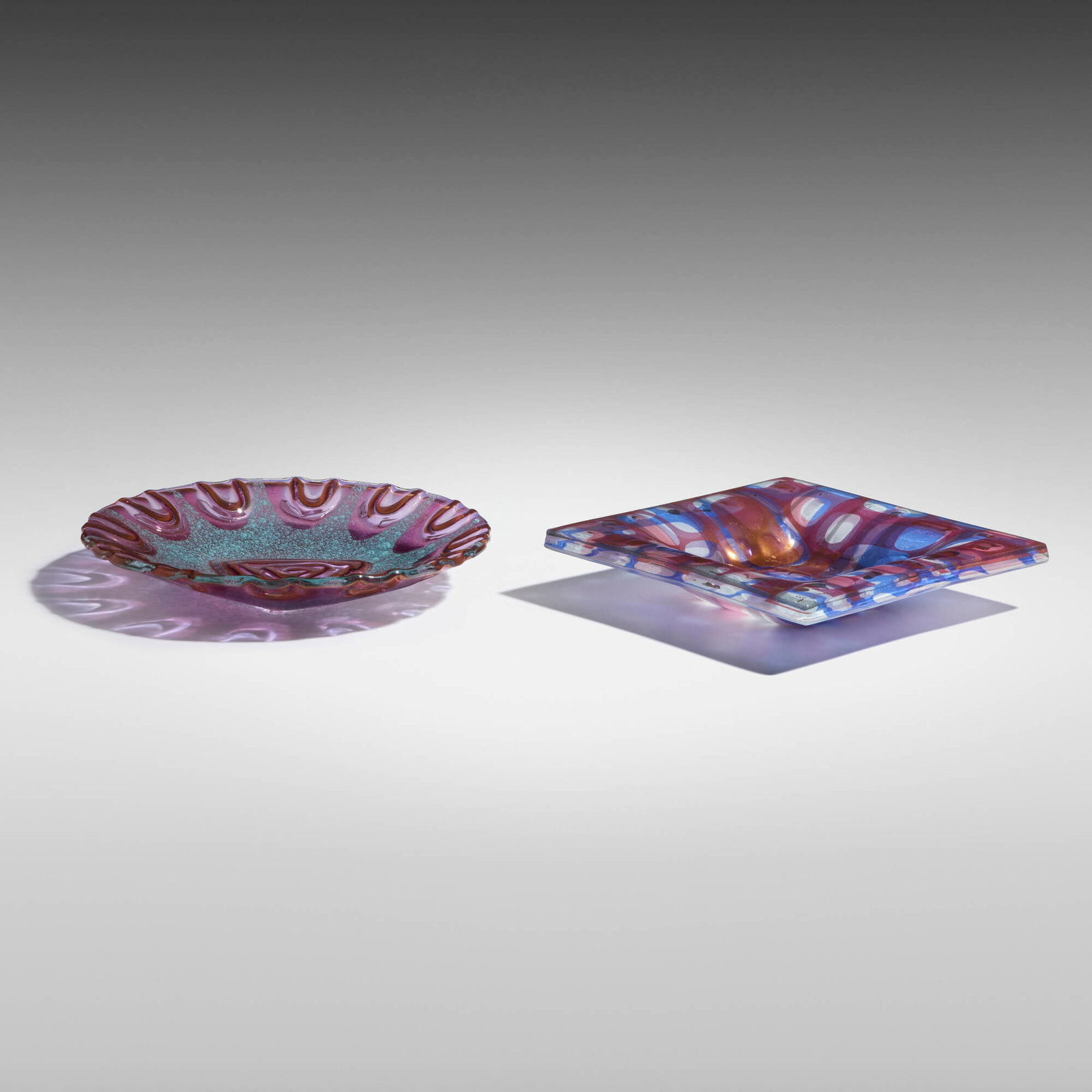 Michael and Frances Higgins, Tow works: Michael and Frances Higgins Tow works Dearborn Glass Company USA, c. 1960 fused glass 1.5 h x 7 w x 7 d in (4 x 18 x 18 cm) 1.25 h x 8 dia in (3 x 20 cm) Lot is comprised of one Gilt signature to