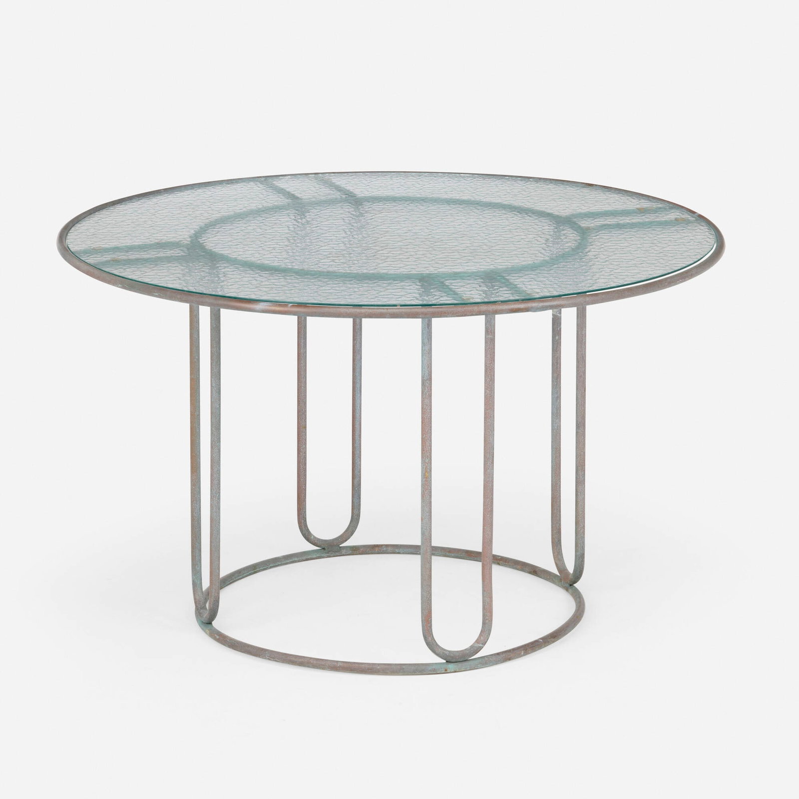 Walter Lamb, Dining table, model C-2700: Walter Lamb Dining table, model C-2700 Brown Jordan USA, c. 1950 bronze, glass 29 h x 48 dia in (74 x 122 cm) Provenance: Collection of Mark McDonald Literature: Walter Lamb, manufacturer's