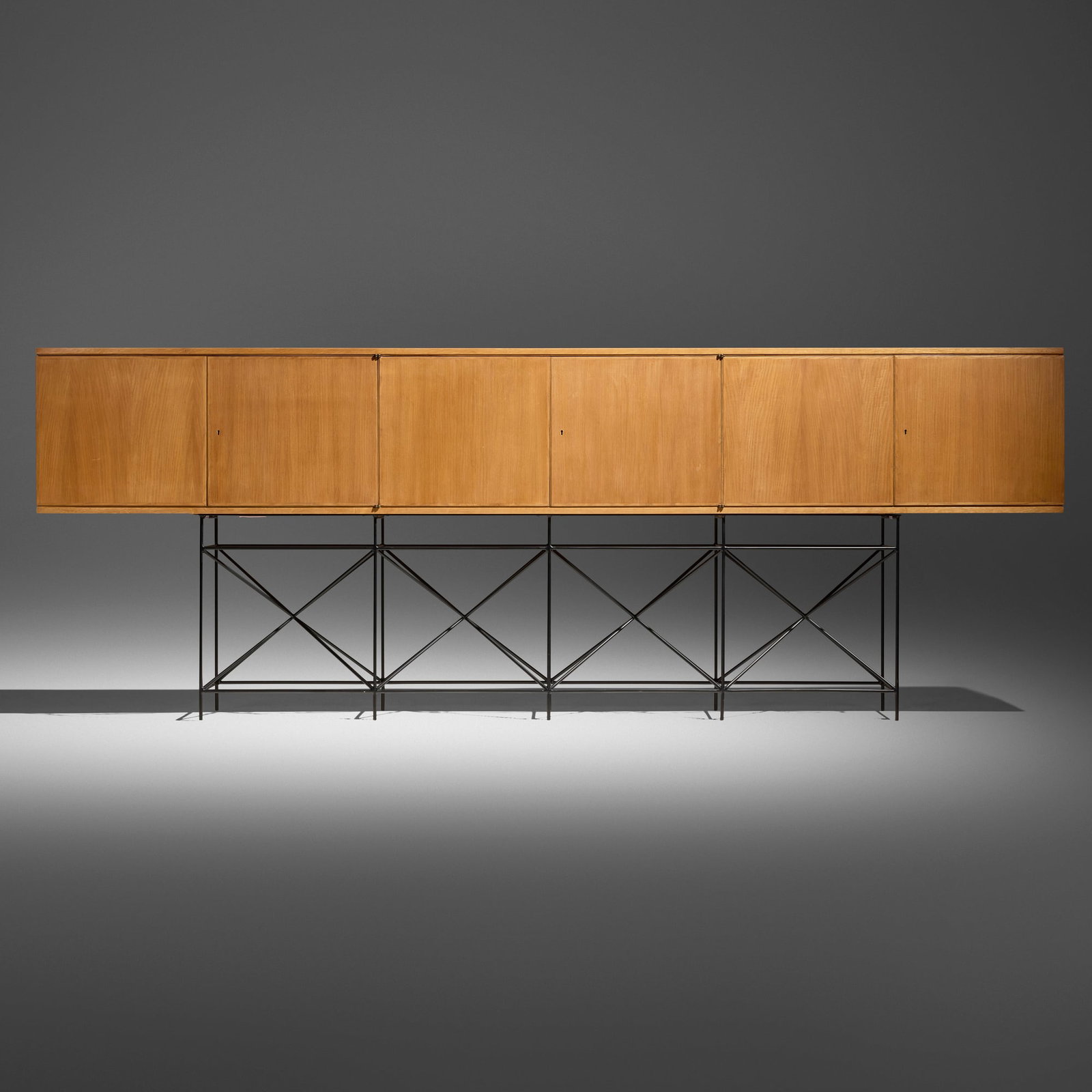 Giovanni Ferrabini, Cabinet: Giovanni Ferrabini Cabinet c. 1955 beech, enameled steel 43 h x 118.25 w x 13.75 d in (109 x 300 x 35 cm) Cabinet features six doors concealing three adjustable shelves. This work will ship from Los