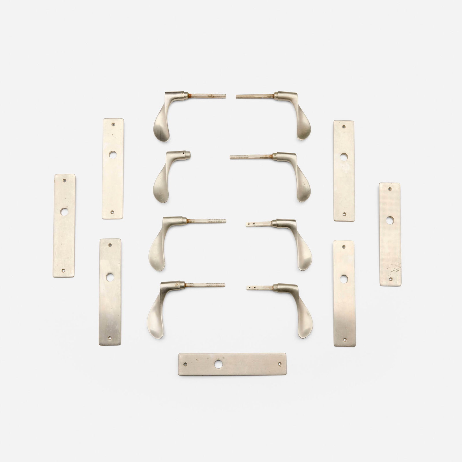 Arne Jacobsen, AJ door handles for the SAS Royal Hotel, set of four: Arne Jacobsen AJ door handles for the SAS Royal Hotel, set of four Denmark, 1956 nickel-plated brass 8.5 h x 8.25 w x 1.75 d in (22 x 21 x 4 cm) This design was created for the SAS Royal Hotel in Cope