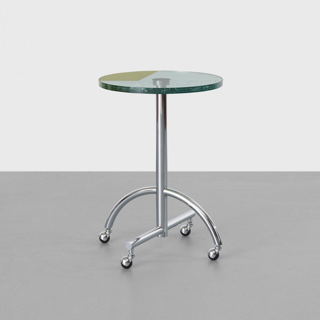 Shiro Kuramata Sally table: Shiro Kuramata Sally table Memphis Japan, 1987 laminated glass, chrome-plated steel, rubber 23 dia x 30.25 h inches Literature: Shiro Kuramata 1934-1991, Hara et al., pg. 185 Memphis Milano, manufactu