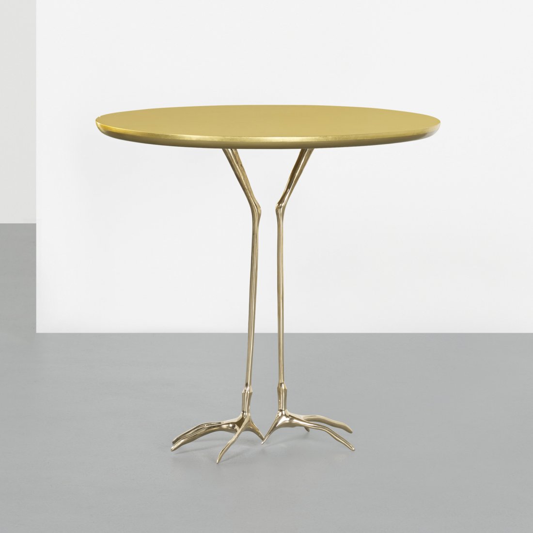 Meret Oppenheim Traccia table: Meret Oppenheim Traccia table from the Ultramobile collection Simon Gavina Switzerland, 1939/1971 gold leaf over wood, cast bronze 26.75 w x 20.75 d x 25.5 h inches Signed with decal manufacturer's la