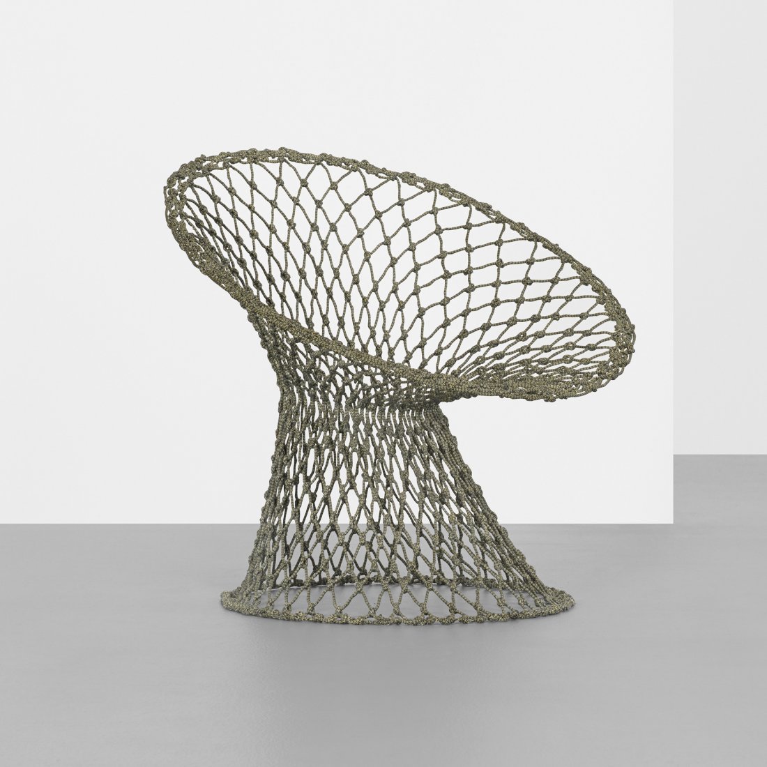 Marcel Wanders Fishnet chair: Marcel Wanders Fishnet chair The Netherlands, 2001 carbon and epoxy-coated aramid fibers 32 w x 28 d x 30 h inches The Fishnet chair is an extension of the transparent and functional qualities of Wand