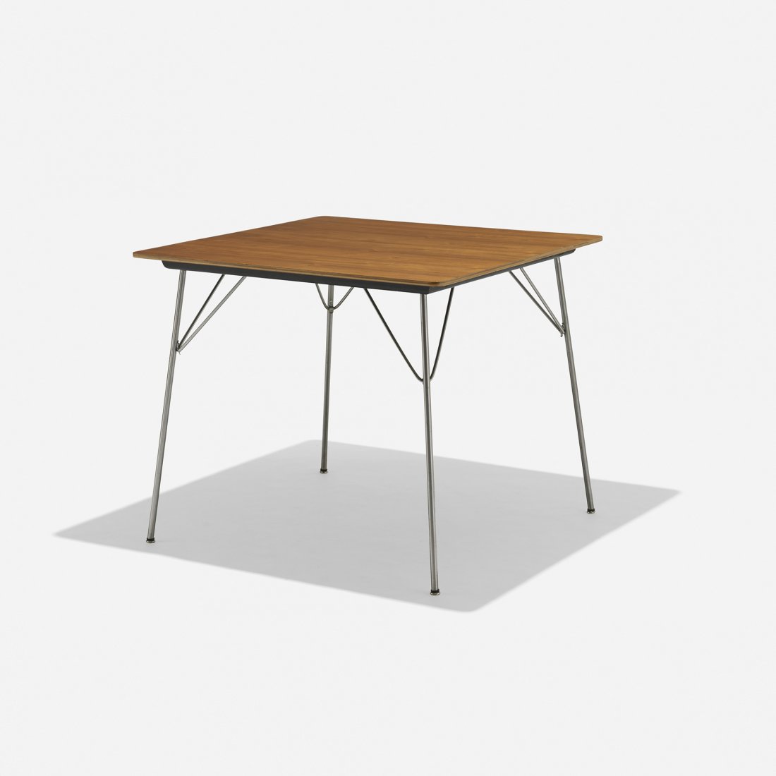 Charles and Ray Eames DTM-2: Charles and Ray Eames DTM-2 Herman Miller USA, 1947/c. 1950 walnut, chrome-plated steel, lacquered wood, rubber 34 w x 34 d x 29 h inches Signed with decal manufacturer's label to underside: [Herman M