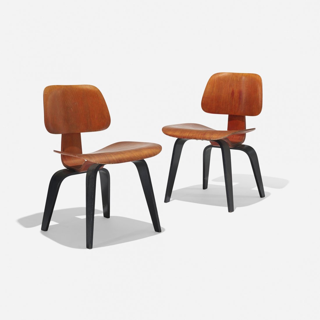 Charles and Ray Eames special-order DCWs, pair: Charles and Ray Eames special-order DCWs, pair Evans Products/Herman Miller USA, 1945/1947 aniline-dyed birch plywood, rubber 19.25 w x 21 d x 28.75 h inches This pair of DCWs features a rare two-tone