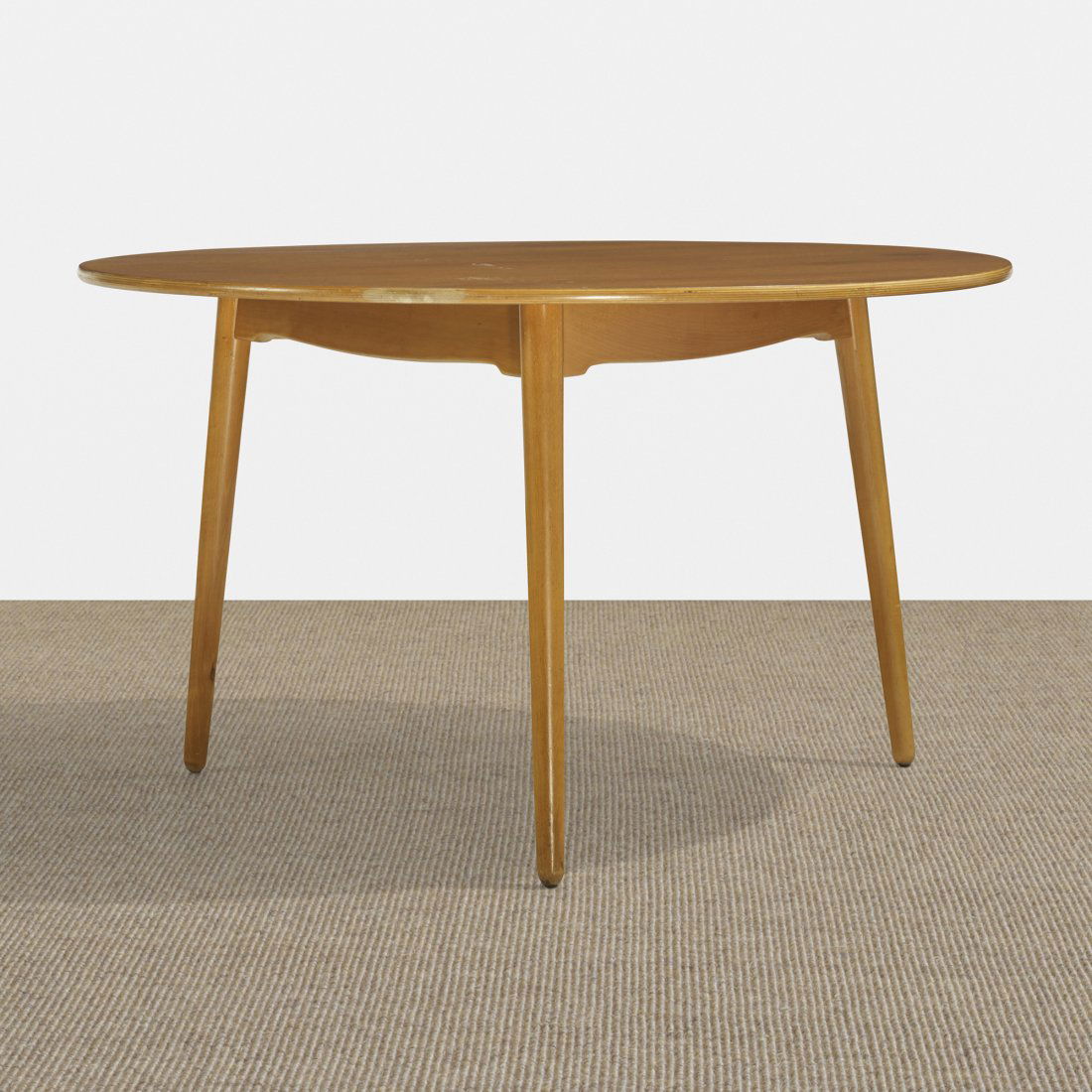 Hans Wegner dining table: Hans Wegner dining table Fritz Hansen Denmark, 1952 teak plywood, beech 47.25 dia x 27.75 h inches Signed with stamped manufacturer's mark to underside: [FH Danmark]. Literature: Wegner: En Dansk Mobe
