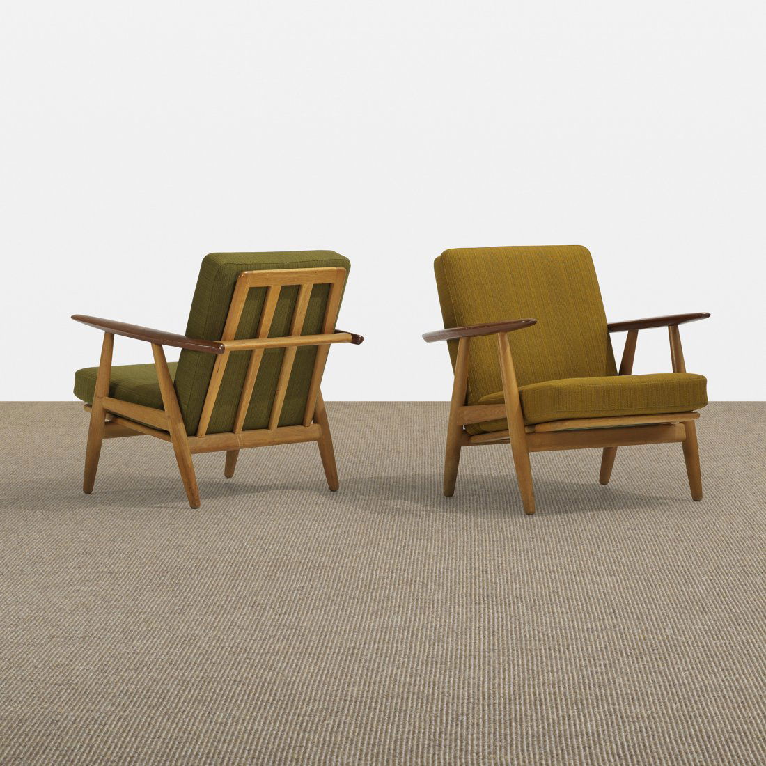 Hans Wegner lounge chairs model GE240, pair: Hans Wegner lounge chairs model GE240, pair Getama Denmark, 1955 teak, oak, upholstery 26.75 w x 30 d x 29.5 h inches Signed with branded manufacturer's mark to underside of each example: [Getama Geds
