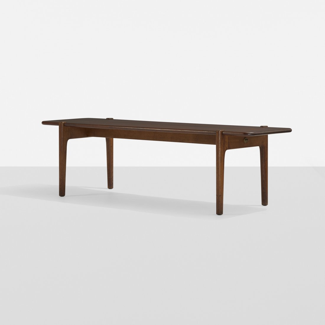 Hans Wegner coffee table: Hans Wegner coffee table Johannes Hansen Denmark, c. 1950 teak, stained oak 59 w x 18 d x 17 h inches Signed with branded manufacturer's mark to underside: [Johannes Hansen Copenhagen Denmark]. Litera