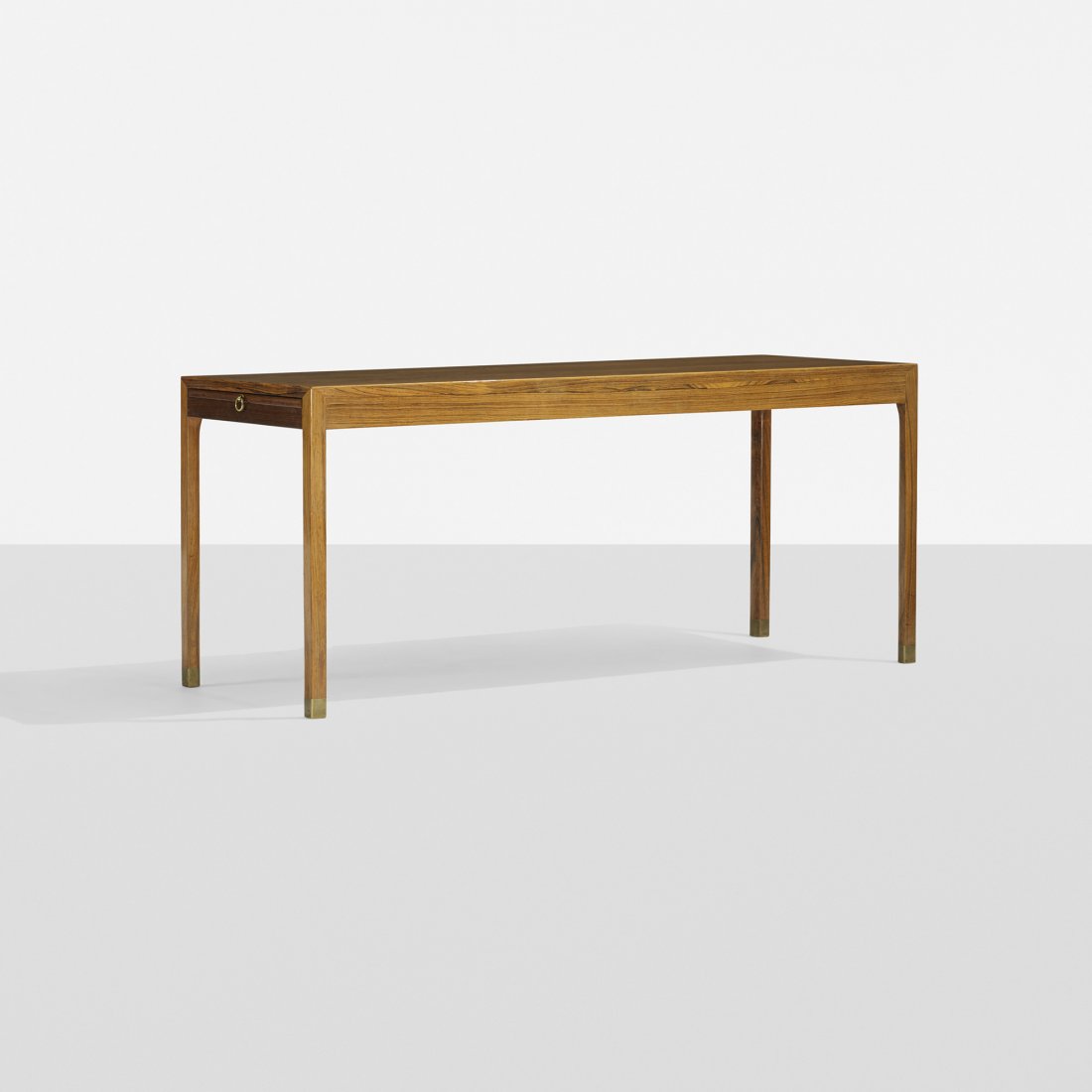 Ole Wanscher coffee table: Ole Wanscher coffee table A.J. Iversen Snedkermester Denmark, c. 1955 rosewood, laminate, brass 48 w x 19 d x 20.75 h inches Table features two pull-out work surfaces. Signed with partial paper manufa