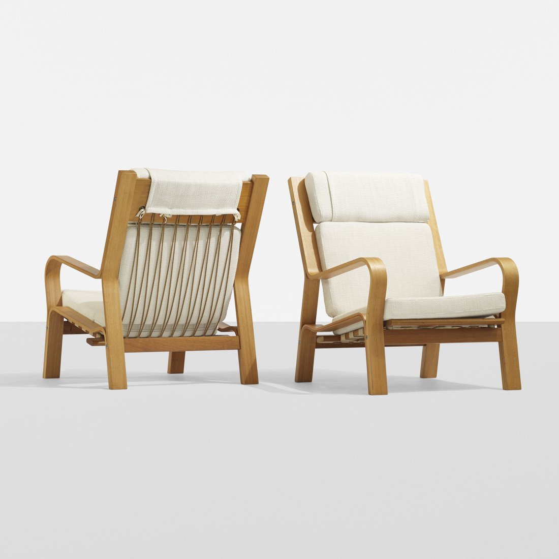 Hans Wegner lounge chairs, pair: Hans Wegner lounge chairs, pair Getama Denmark, c. 1968 laminated oak, upholstery, flagline 28.25 w x 32 d x 36.5 h inches Provenance: Collection of Mr. David Gough, Copenhagen