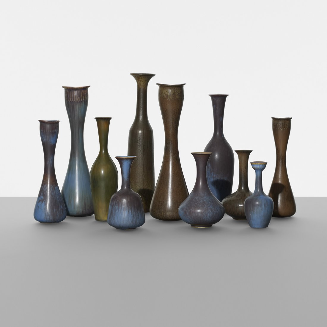 Gunnar Nylund Collection of eleven vases: Gunnar Nylund Collection of eleven vases Rorstrand Sweden, c. 1950 glazed stoneware 3 dia x 13.25 h inches Incised signature and studio mark to underside of each example: [R Sweden GN].