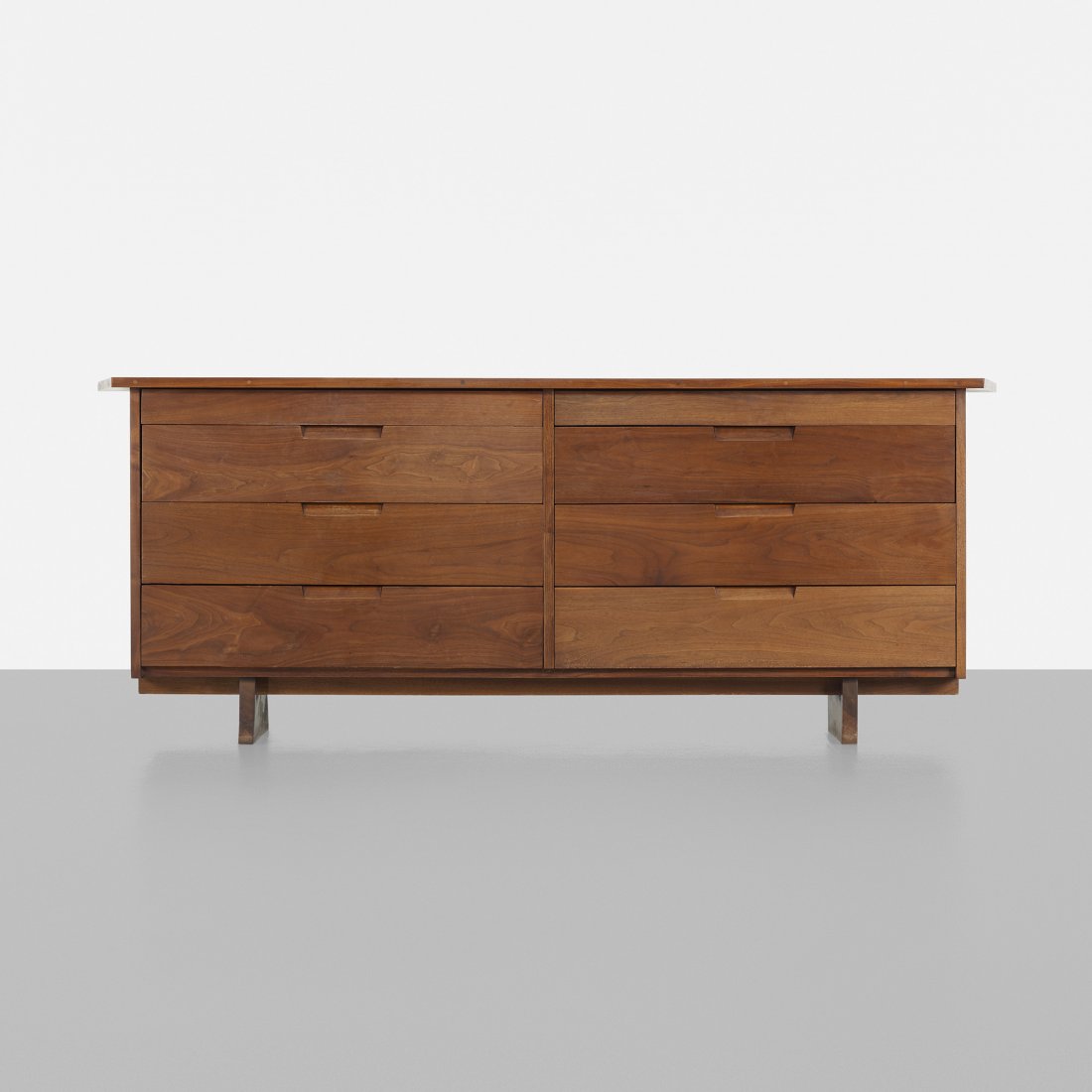 George Nakashima cabinet: George Nakashima cabinet USA, c. 1960 American black walnut 83 w x 21.5 d x 32 h inches Joined-top with overhanging edge; cabinet features eight drawers.