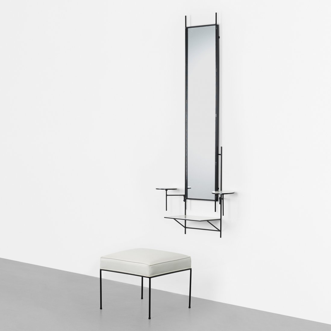 Paul McCobb wall-mounted vanity and stool: Paul McCobb wall-mounted vanity and stool Directional USA, c. 1950 enameled steel, mirrored glass, vinyl, vitrolite 28.75 w x 8.75 d x 62 h inches Stool measures: 20 w x 20 d x 17 h inches.