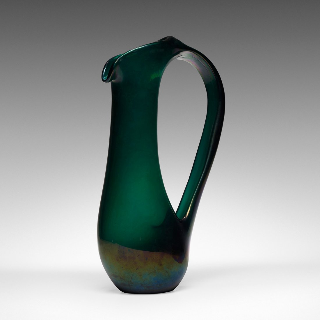 Giorgio Ferro Anso Volante pitcher: Giorgio Ferro Anso Volante pitcher A.V.E.M. Italy, 1950 iridized glass 8 w x 4.25 d x 14 h inches Literature: Murano Glas 1945-1970, Heiremans, fig. 10 illustrates related works