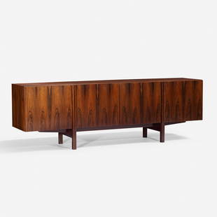 Ib Kofod-Larsen cabinet: Ib Kofod-Larsen cabinet Faarup Mobelfabrik Denmark, c. 1960 rosewood 90.5 w x 20.5 d x 29 h inches Cabinet features four doors concealing storage equipped for adjustable shelves.