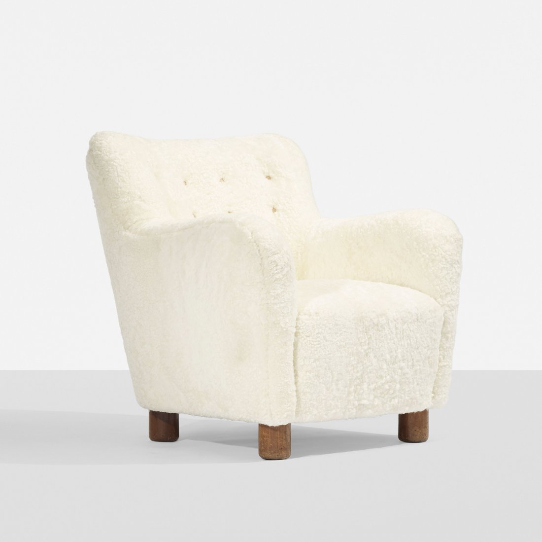 Flemming Lassen lounge chair: Flemming Lassen lounge chair A.J. Iversen Snedkermester Denmark, c. 1936 sheepskin, elm, leather 30 w x 33 d x 31.5 h inches This chair is a variant of a sofa Lassen exhibited at the 1936 Cabinetmaker