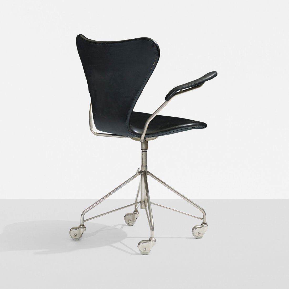 Arne Jacobsen Sevener armchair, model 3217: Arne Jacobsen Sevener armchair, model 3217 Fritz Hansen Denmark, 1955 matte chrome-plated steel, vinyl, leather 26 w x 20 d x 34 h inches Signed with impressed manufacturer's mark to underside: [FH Da