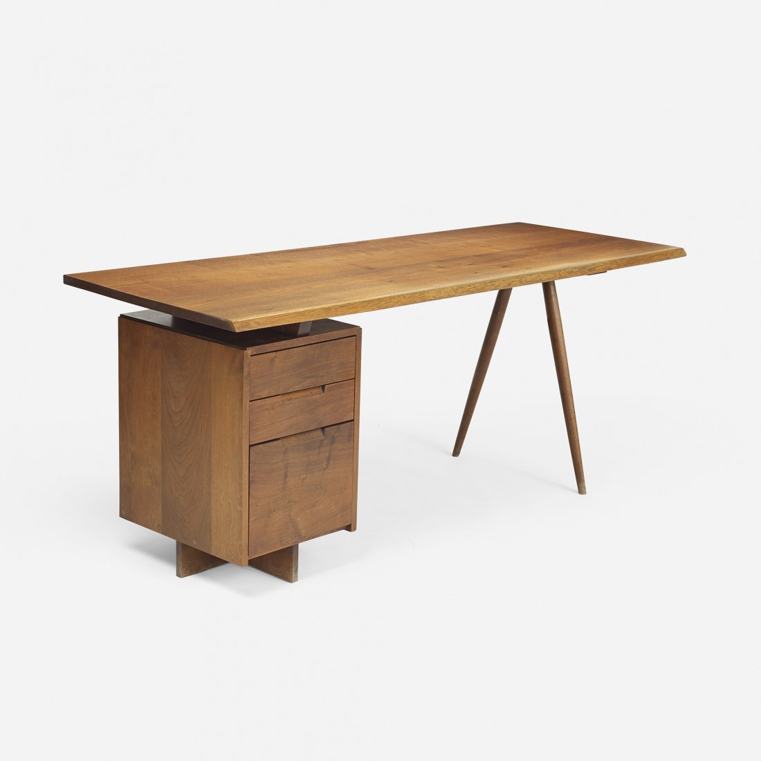 George Nakashima Single-Pedestal Desk: George Nakashima Single-Pedestal Desk USA, c. 1965 American black walnut 72 w x 26.25 d x 28.5 h inches Joined top with one free edge and sap grain detail. Literature: George Nakashima Woodworker, stu