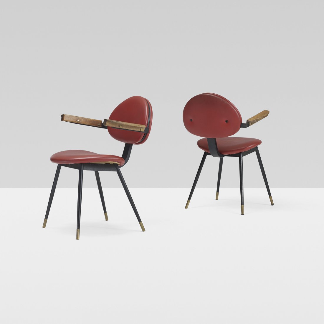 Carlo Mollino pair of chairs: Carlo Mollino pair of chairs from Lutrario Hall, Turin Doro Italy, 1959 enameled steel, Italian walnut, vinyl, brass 21.75 w x 23 d x 29.5 h inches Signed with upholsterer's label to underside of each