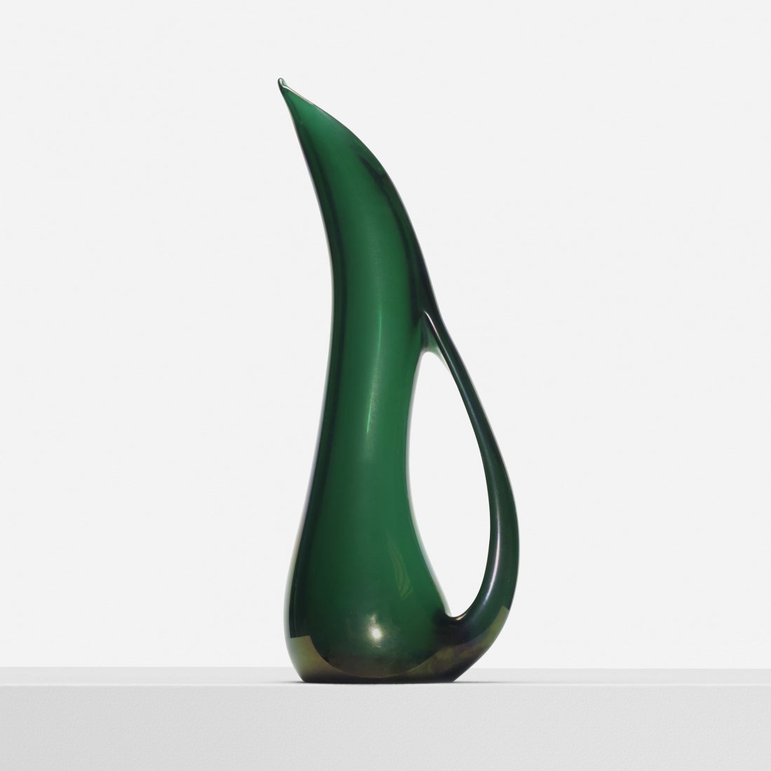 Giorgio Ferro Anse Volante pitcher: Giorgio Ferro Anse Volante pitcher A.V.E.M. Italy, 1950 glass 5.5 w x 4 d x 14.5 h inches Signed with circular foil manufacturer's label to underside: [AVEM Made in Italy Murano].