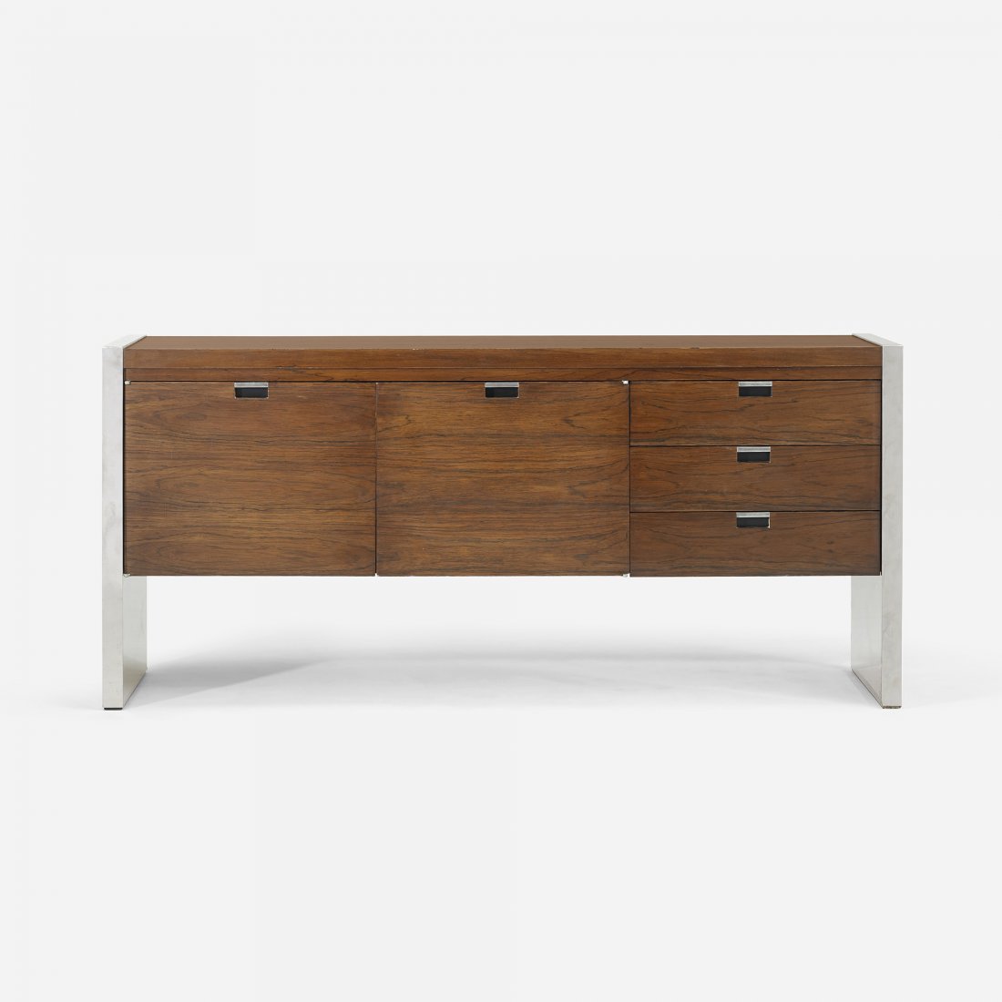 Roger Sprunger credenza: Roger Sprunger credenza Dunbar USA, c. 1967 rosewood, chrome-plated steel 61.25 w x 18.25 d x 27.25 h inches Cabinet features two doors concealing two adjustable shelves and three drawers. Signed with