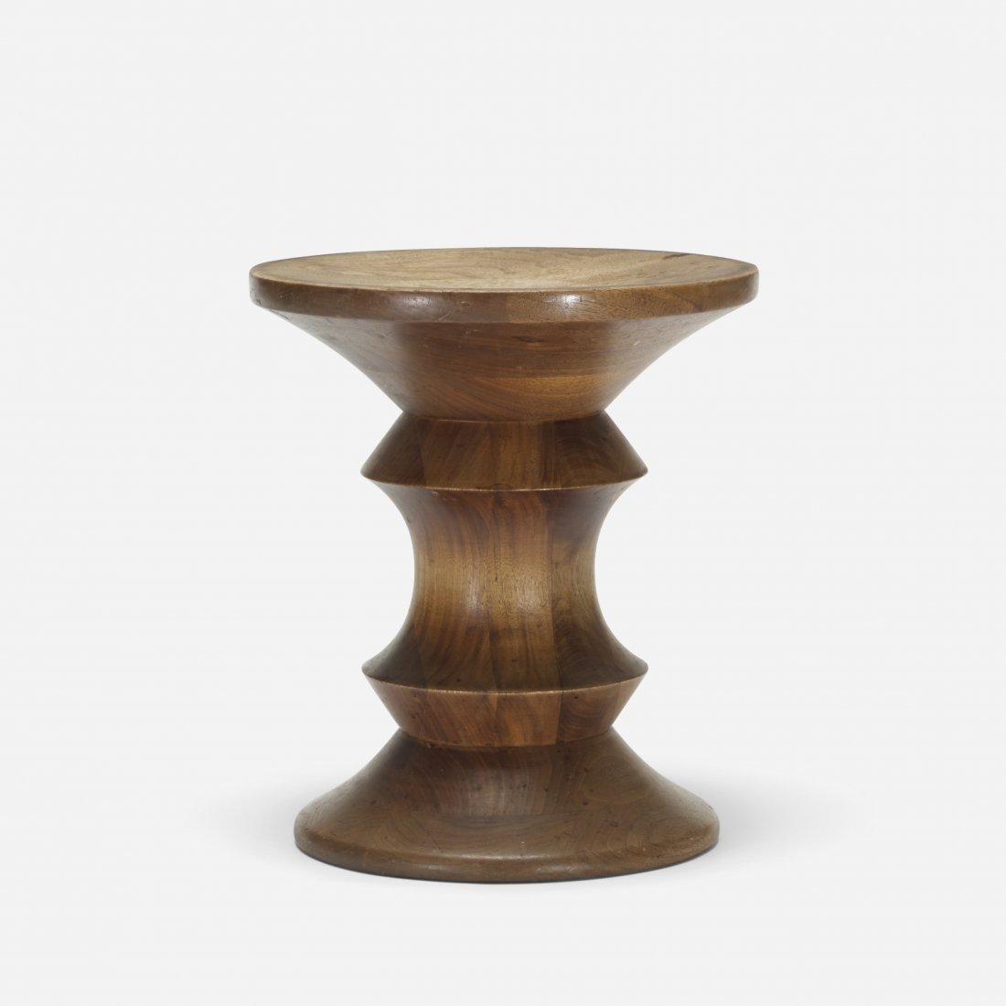 Charles and Ray Eames Time Life stool: Charles and Ray Eames Time Life stool Herman Miller USA, 1960 laminated and carved walnut 13 dia x 15 h inches Literature: Eames Design: The Work of the Office of Charles and Ray Eames, Neuhart, Neuha