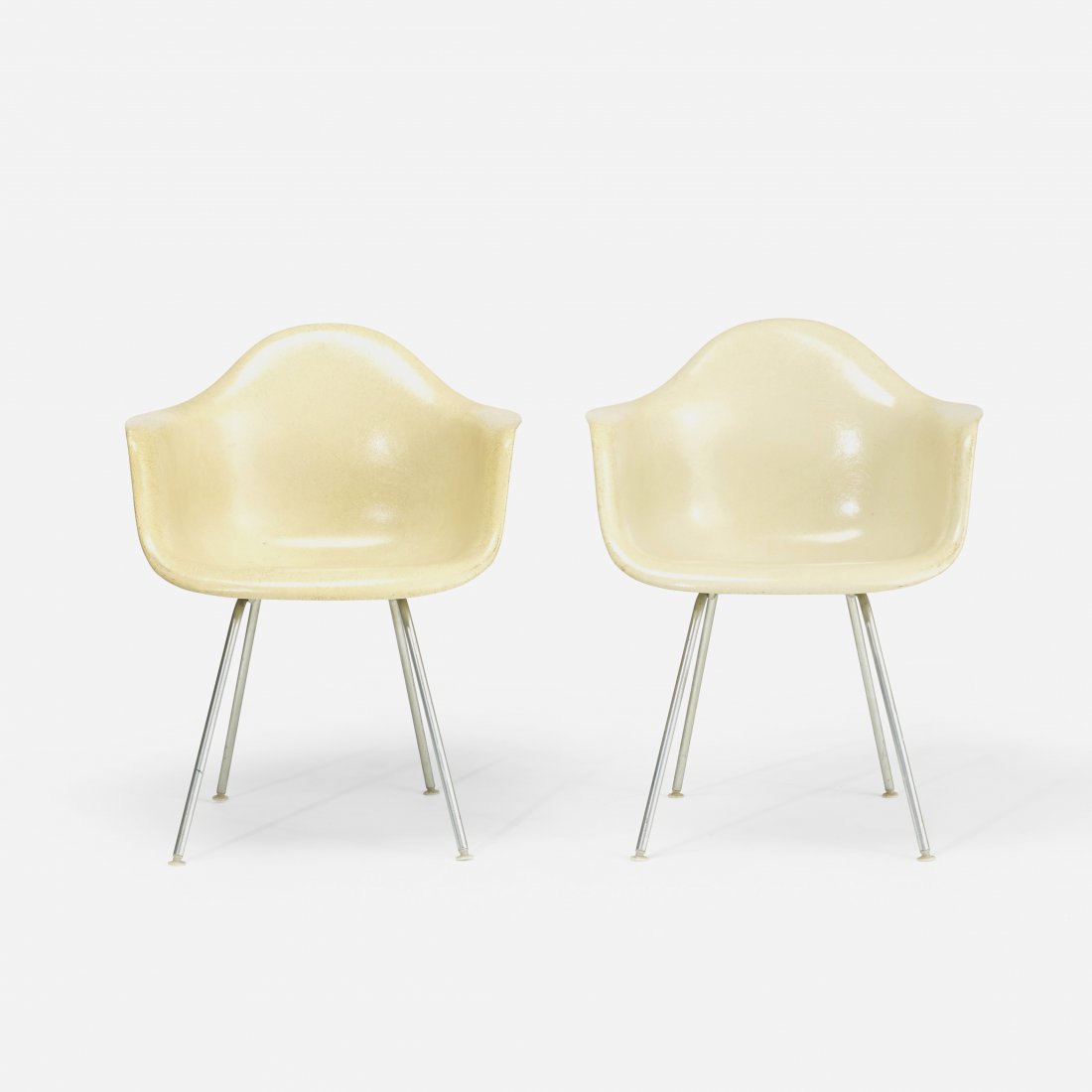 Charles and Ray Eames DAXs, pair: Charles and Ray Eames DAXs, pair USA, 1950/1955 fiberglass, matte chrome-plated steel, plastic 24.5 w x 22 d x 31.5 h inches Signed with applied manufacturer's label to underside of each example: [Her