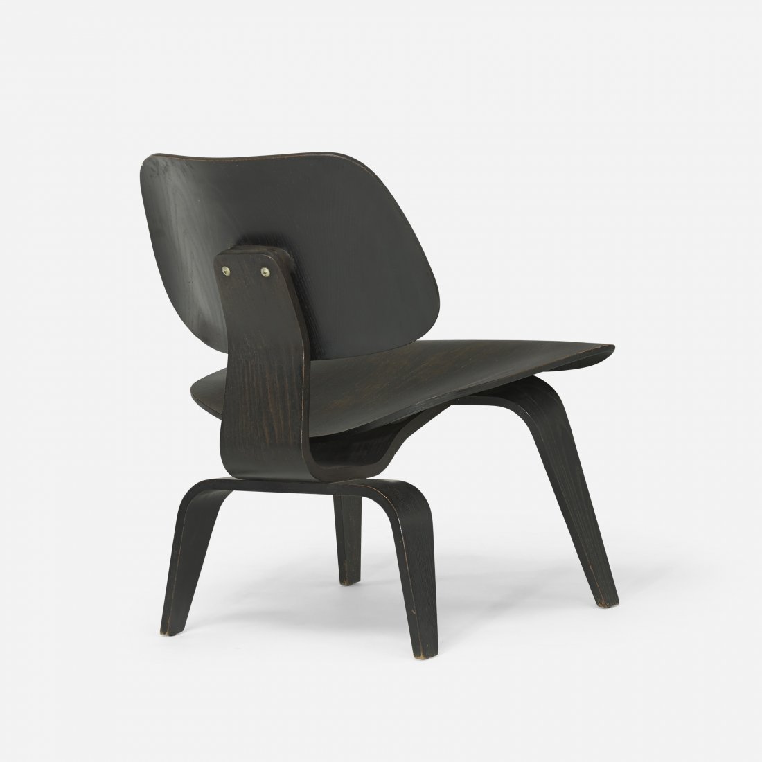 Charles and Ray Eames LCW: Charles and Ray Eames LCW Herman Miller USA, 1945/c. 1950 aniline-dyed ash plywood, rubber 22.25 w x 24.5 d x 27 h inches Signed with impressed manufacturer's mark to underside: [LCW]. Literature: Eam