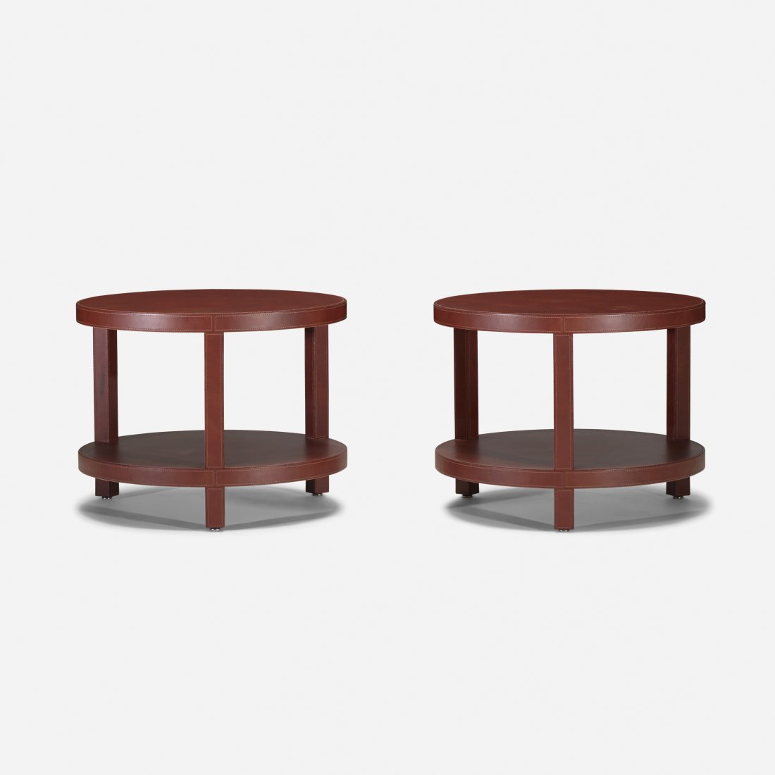 Dominic Chambon occasional tables, pair: Dominic Chambon occasional tables, pair DC & Company France, c. 1970 leather 21.75 dia x 17 h inches Signed with applied metal manufacturer's label to underside: [DC & Company Paris Made in France Dom
